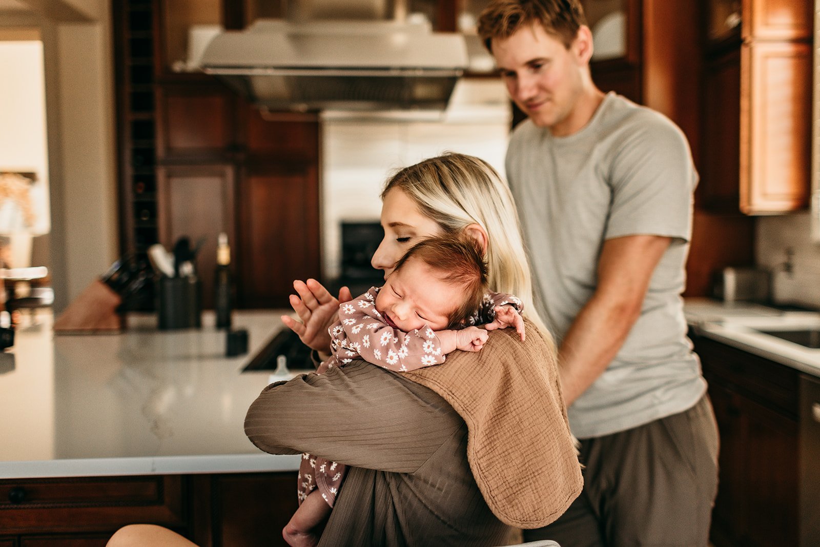 newborn-baby-embrace-kitchen-home.jpg