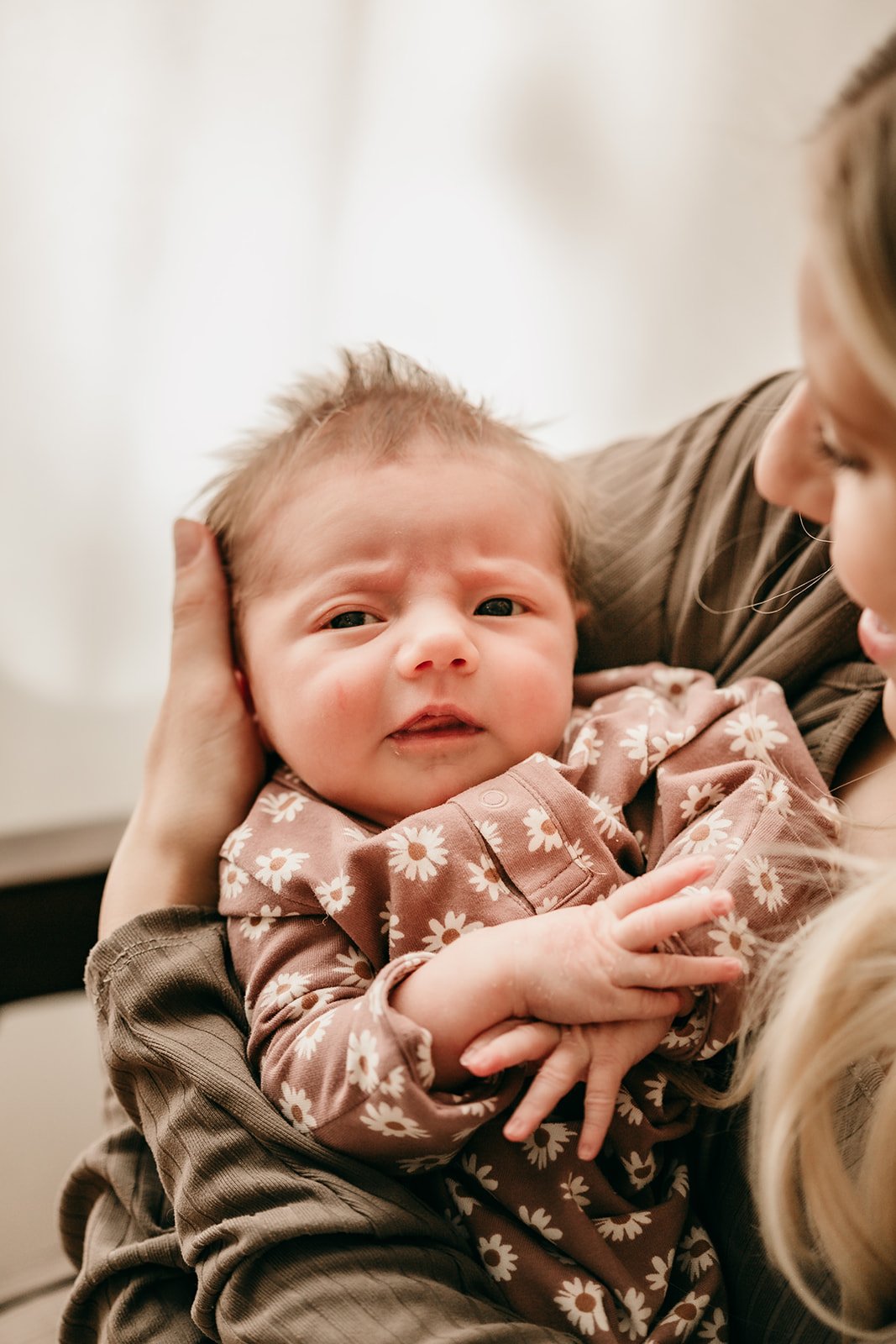 newborn-with-pacifier-in-mothers-arms.jpg