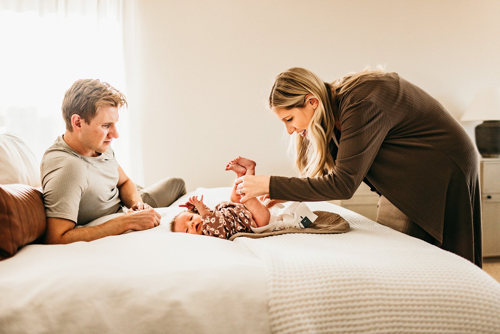 parents-and-baby-diaper-change-bedroom.jpg