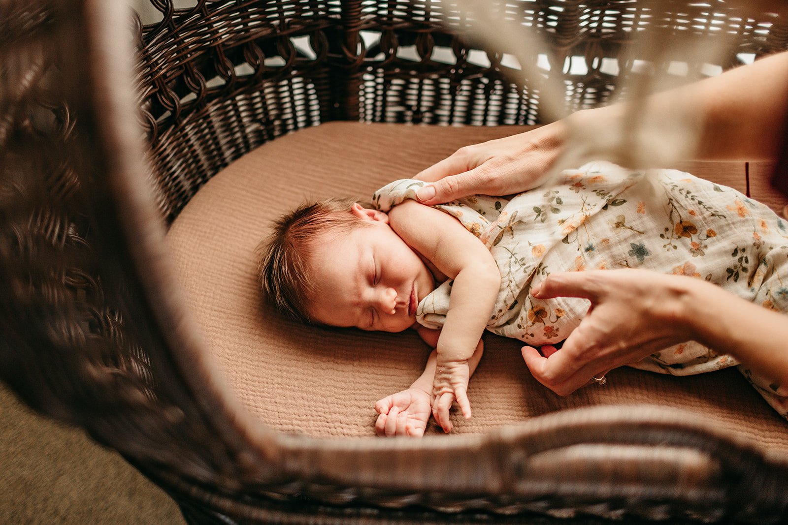 peaceful-newborn-sleeping-in-wicker-basket.jpg