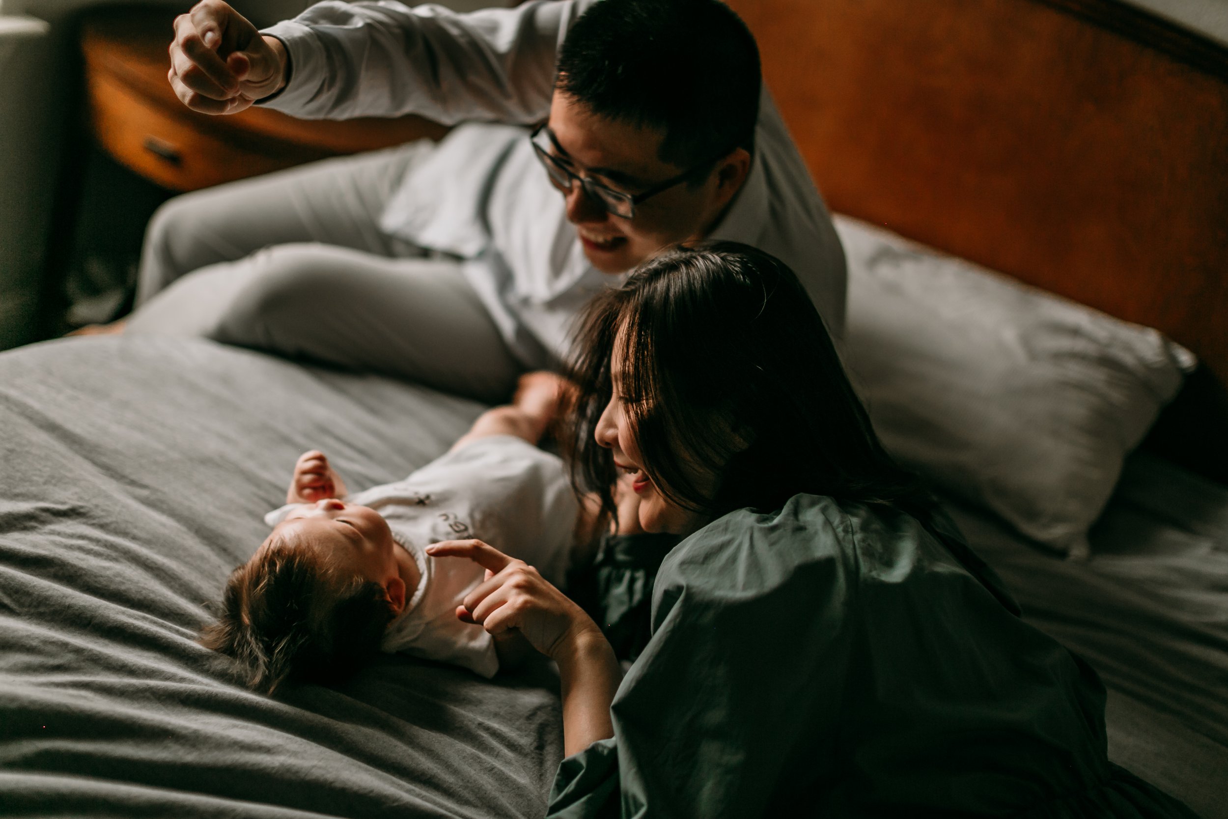 parents-caressing-newborn-baby.jpg