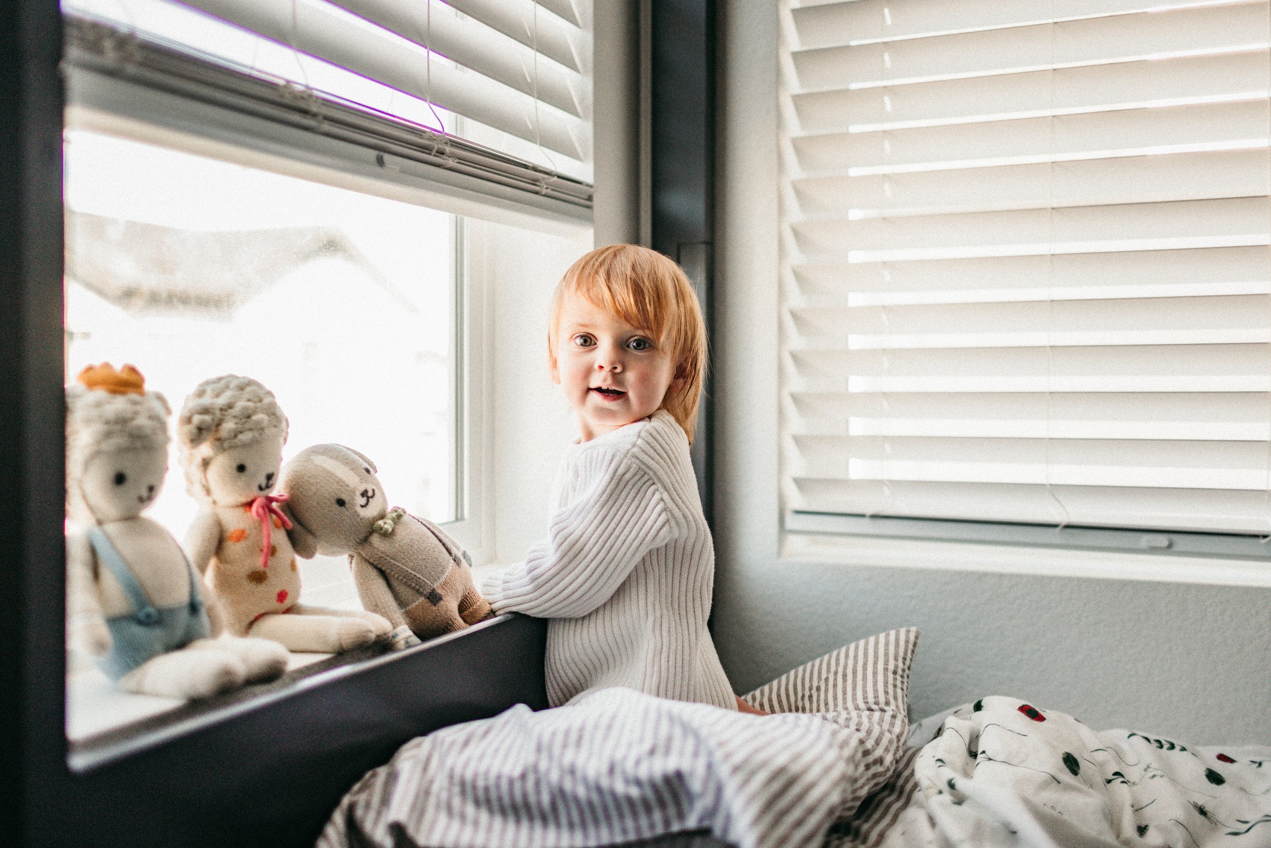 girl spending time with her dolls.jpg