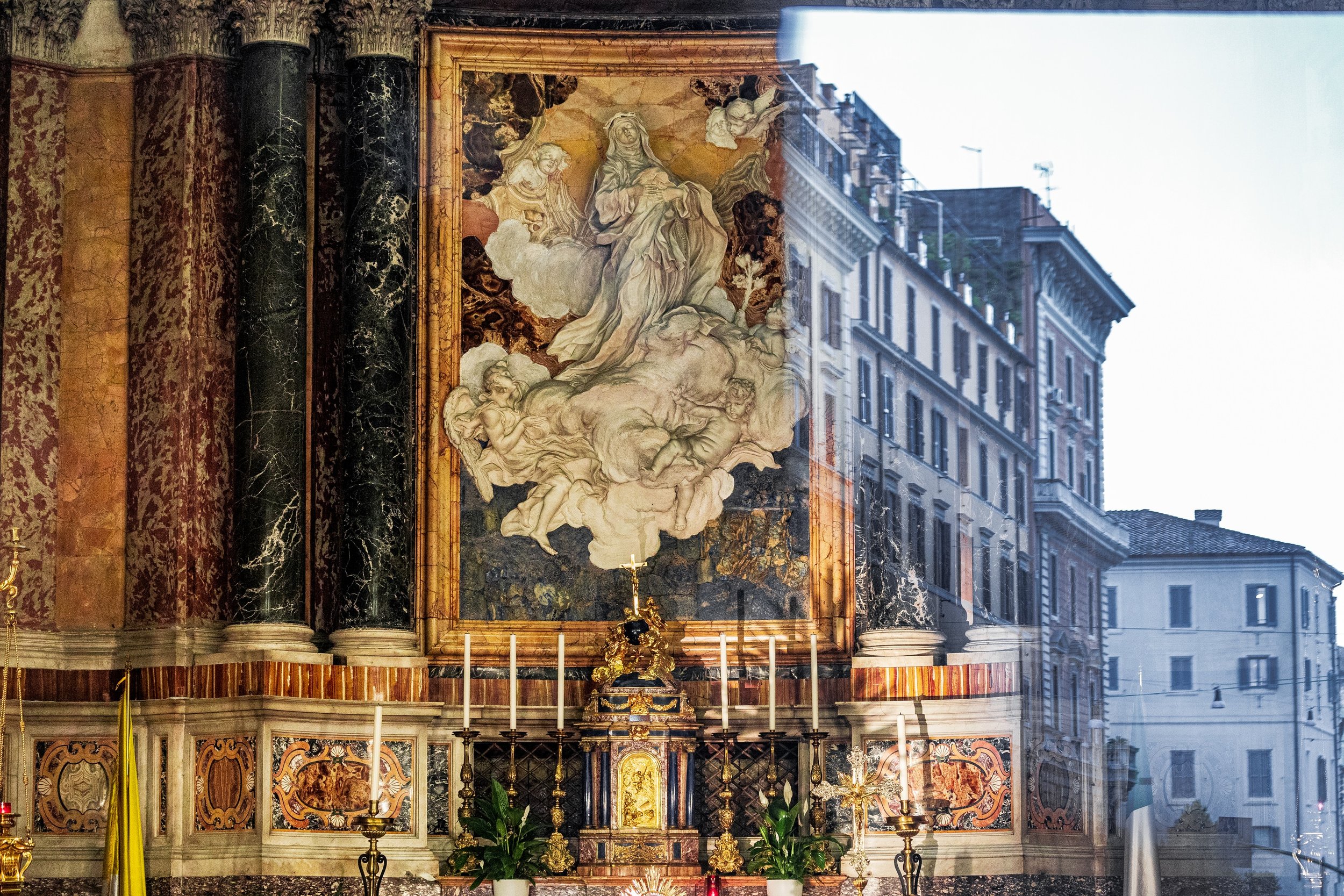Ornate church interior and Roma street facades overlapping through glass reflections