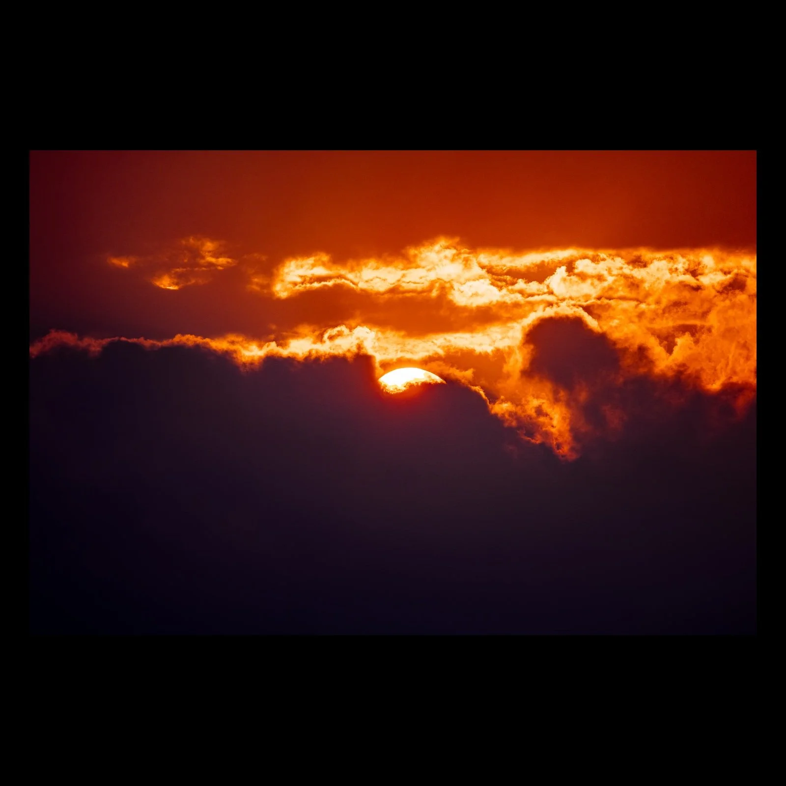 The Last Ember abstract sunset photograph presented in full against a black background