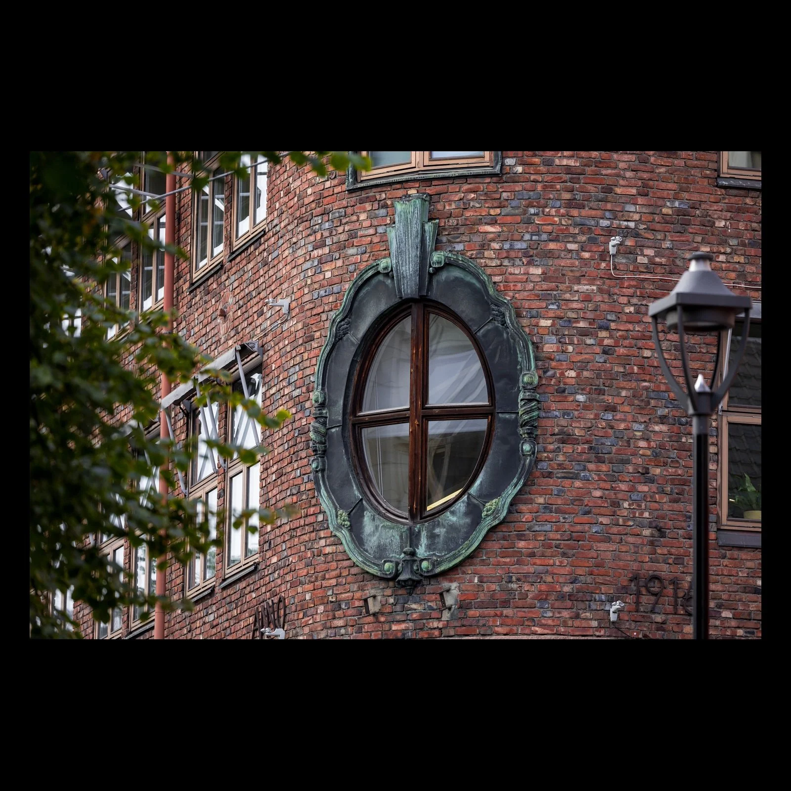 The Corner Window architectural detail photograph presented in full against a black background