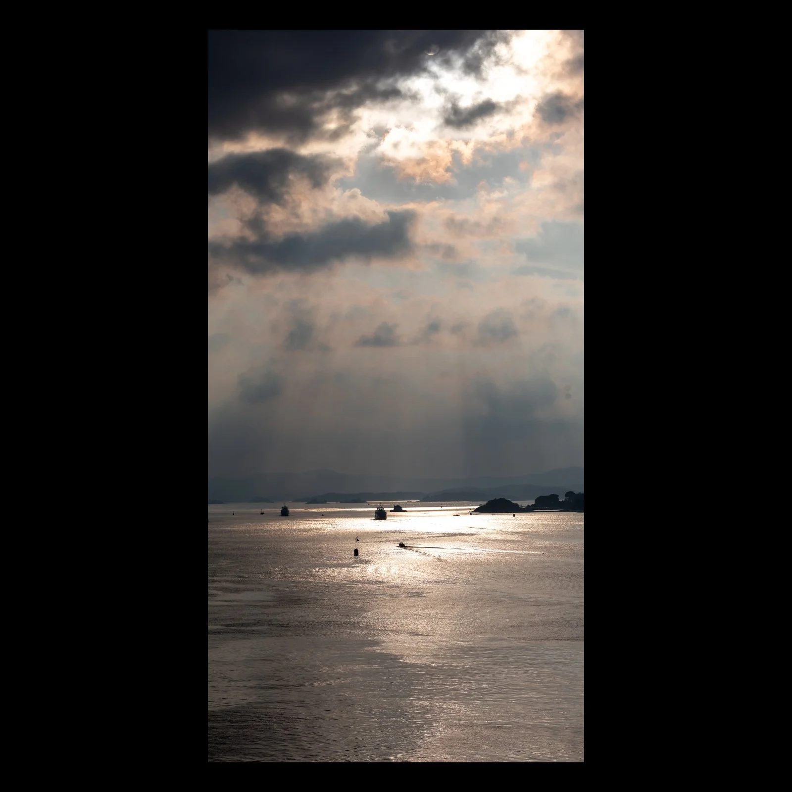 Silver Passage vertical coastal photograph presented in full against a black background