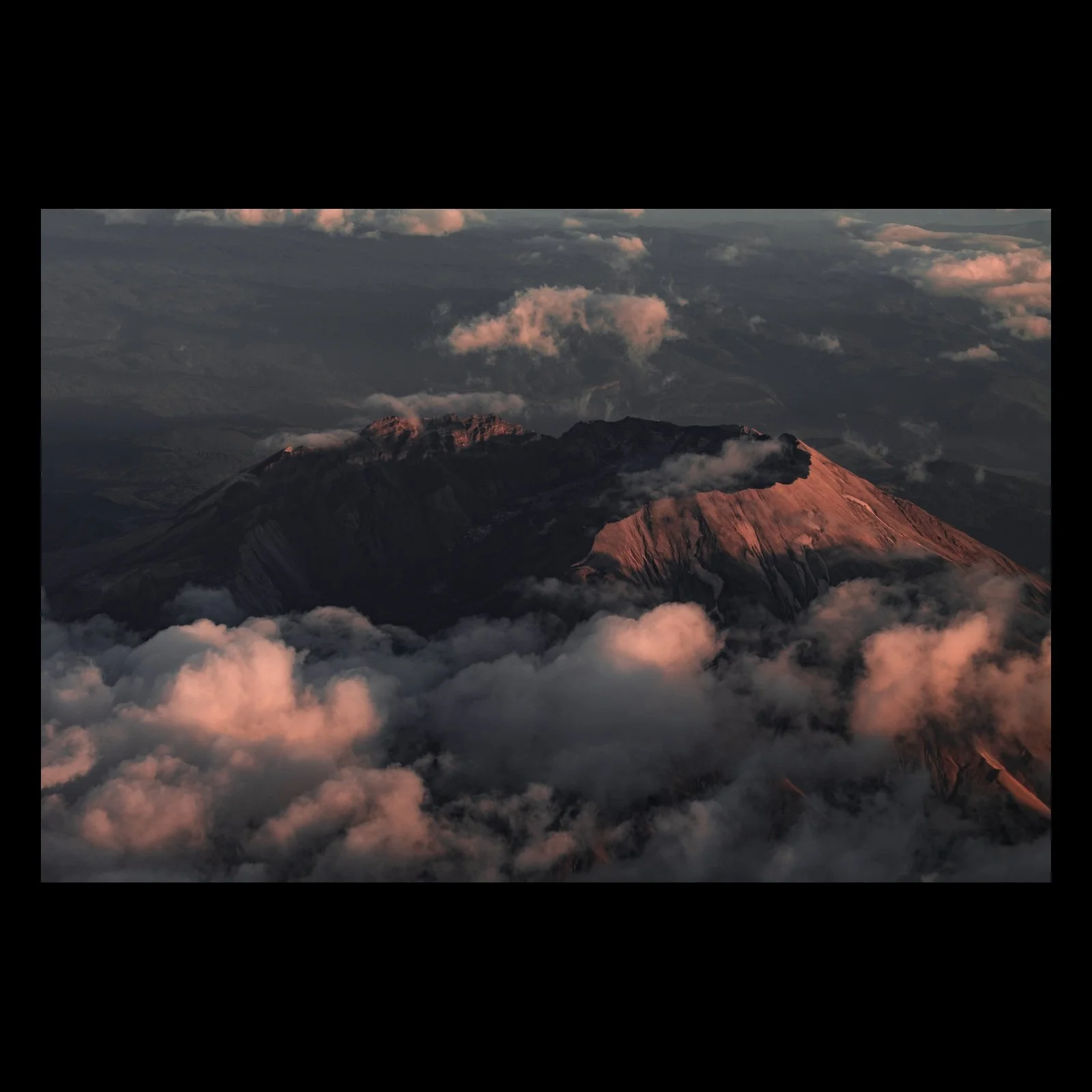 Last Light on Helen aerial Mount St. Helens photograph presented in full against a black background