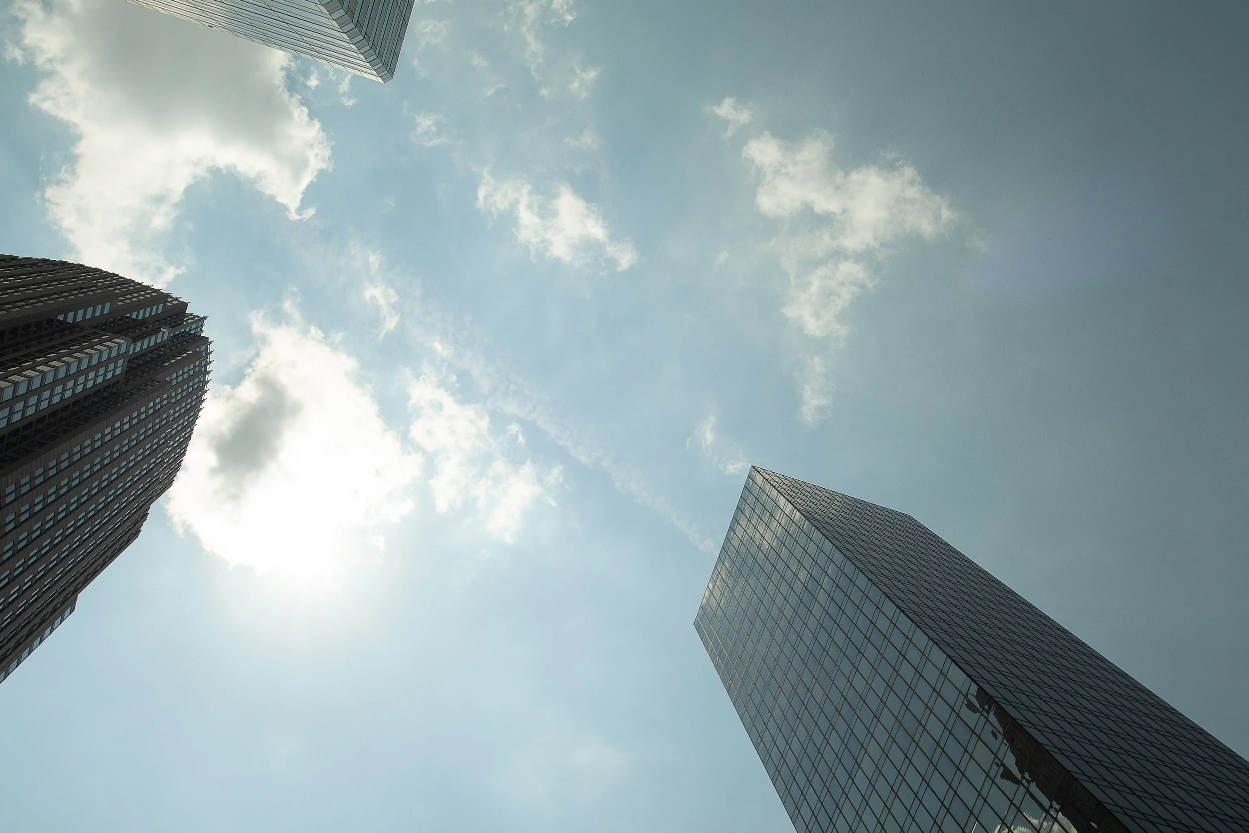 Detail crop from Vertical Weather, emphasizing different facades, angles, and reflections keep the upward view from becoming symmetrical