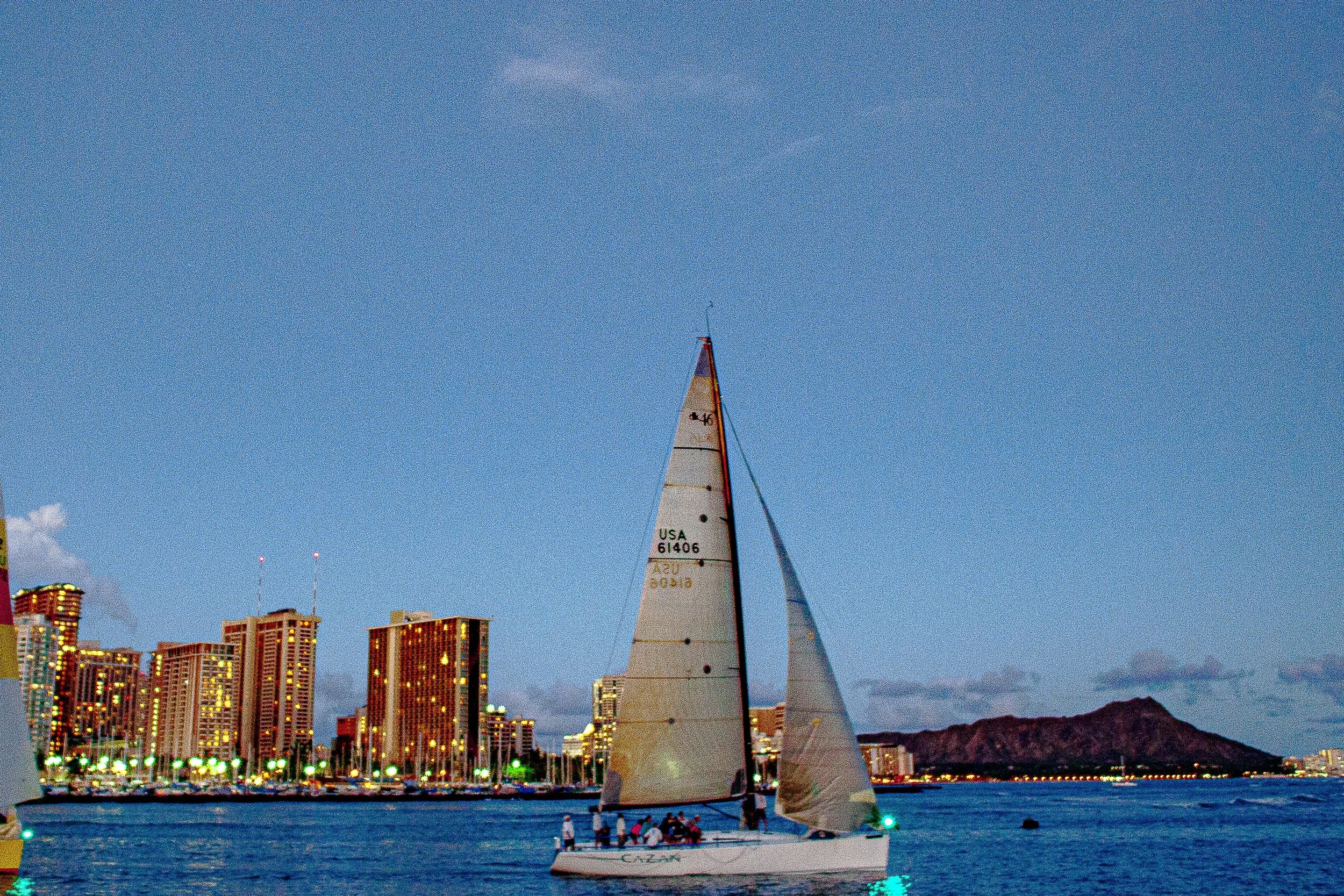 Detail crop from Two Sails, One City, emphasizing rigging, hulls, and buildings become a fine network of vertical lines