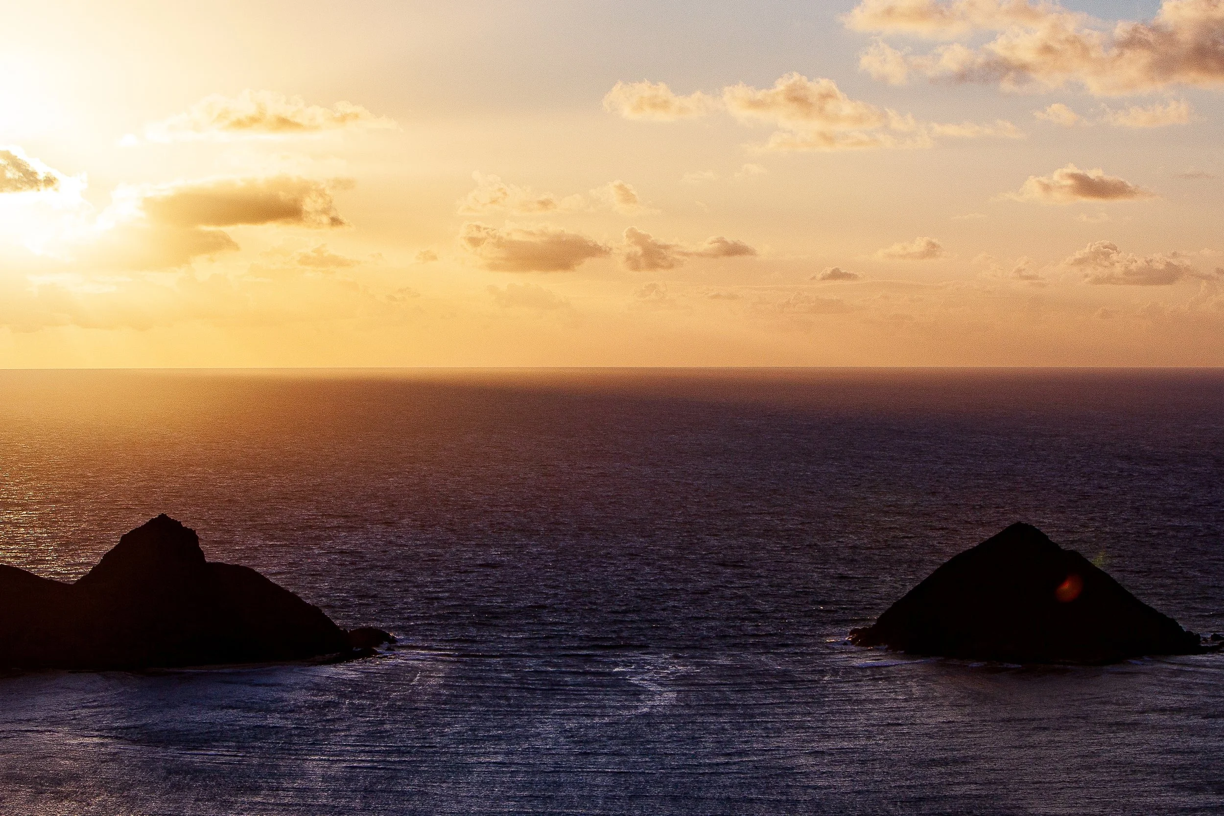 Detail crop from Twin Islands at Dusk, emphasizing each reflection follows a different path around the islands and toward the foreground