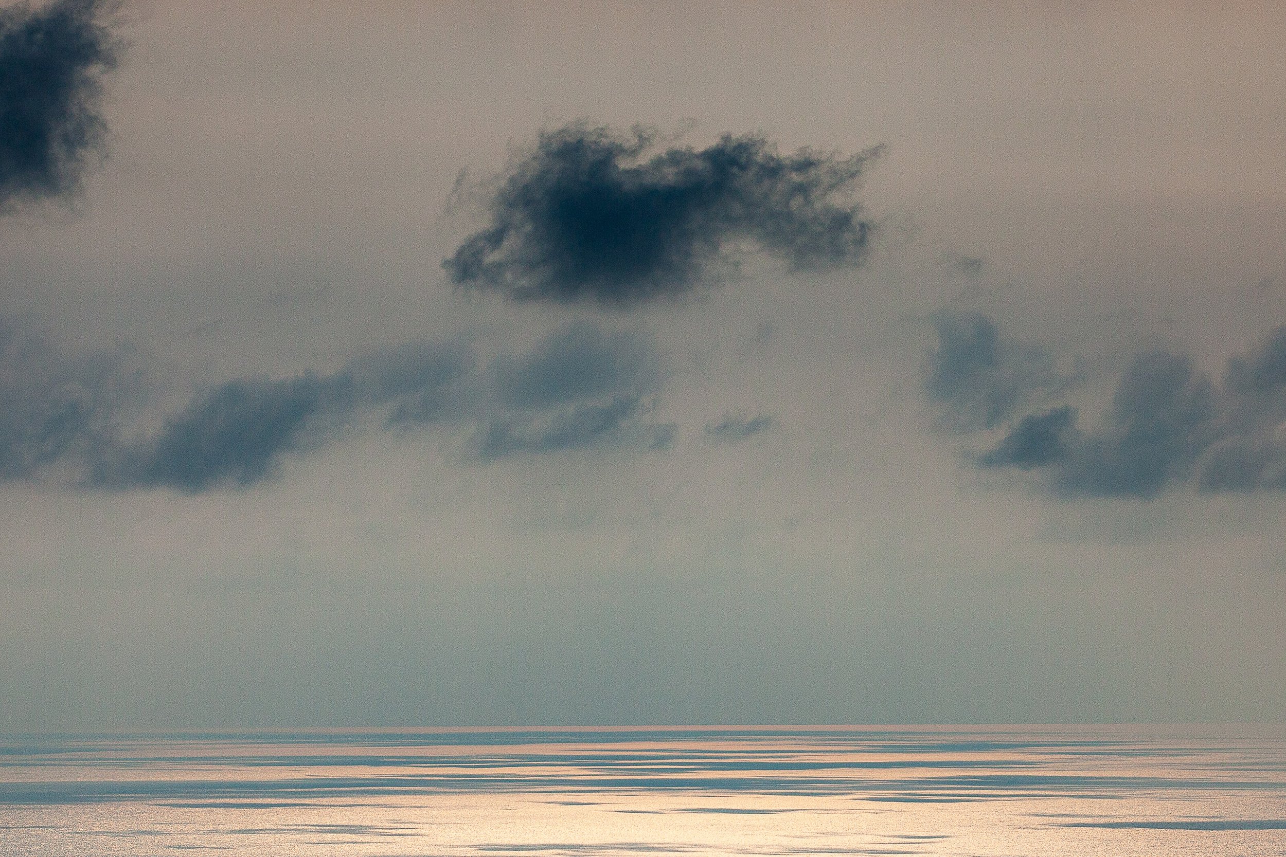 Detail crop from Silver Water, emphasizing soft cloud shapes and barely visible horizon lines keep the seascape visually uncertain