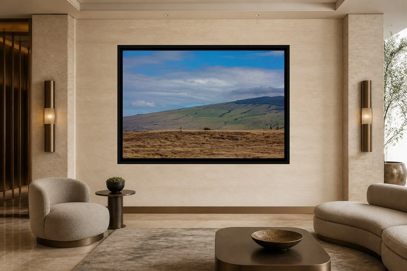Divided Ground displayed in a black frame within a five-star hotel corridor lounge with travertine, bronze, sculptural seating, and a clear central wall
