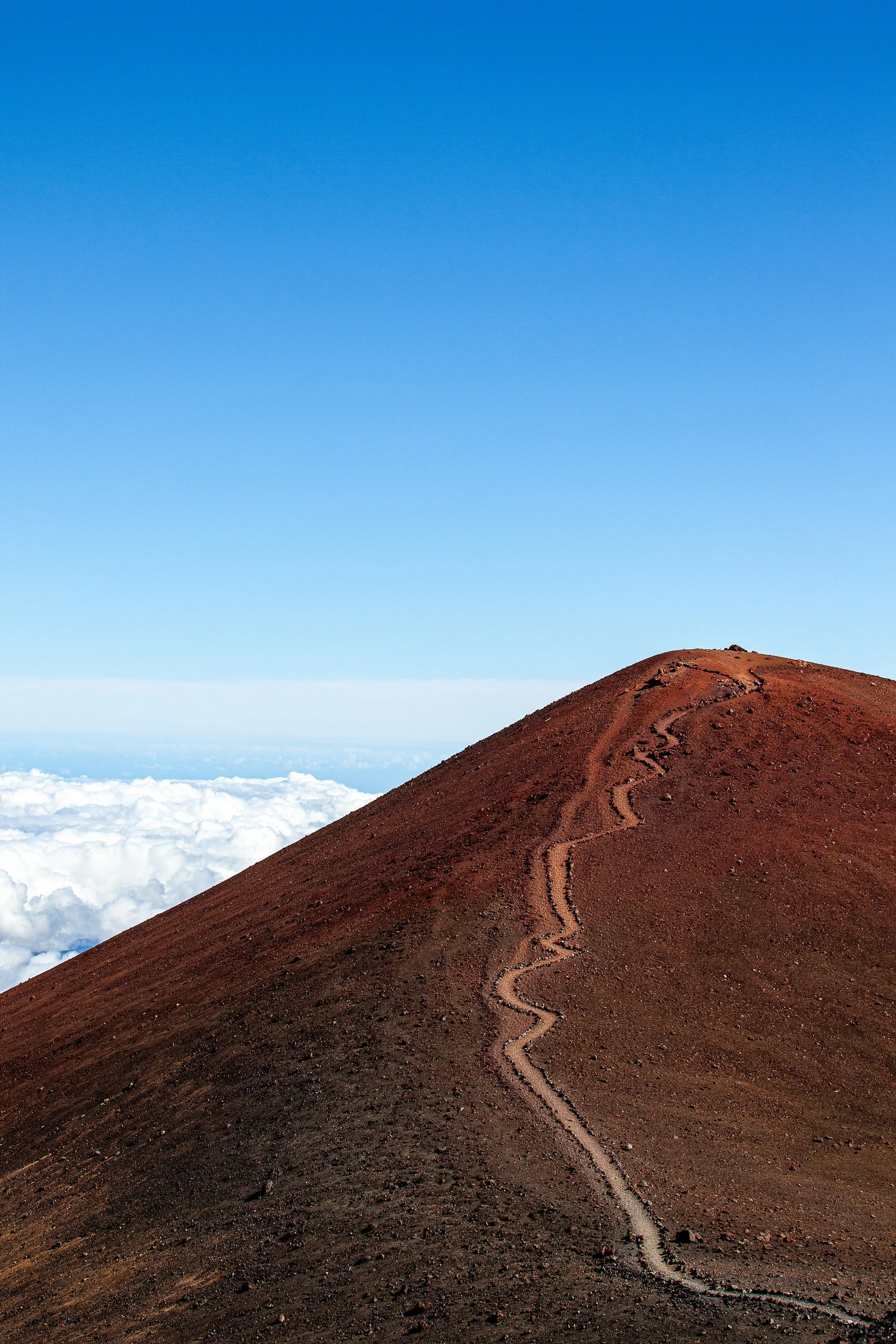 Complete uncropped artwork for Path Above the Clouds, showing a narrow trail climbs a red volcanic ridge above a white layer of clouds