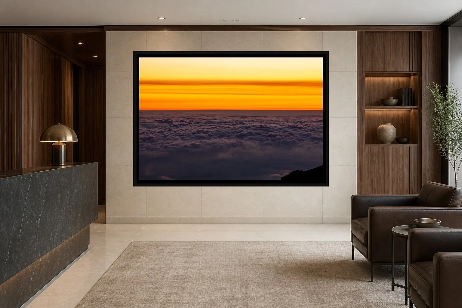 Above the Weather displayed in a black frame within an upscale law-office reception area with honed stone, walnut paneling, quiet seating, and a clear central wall