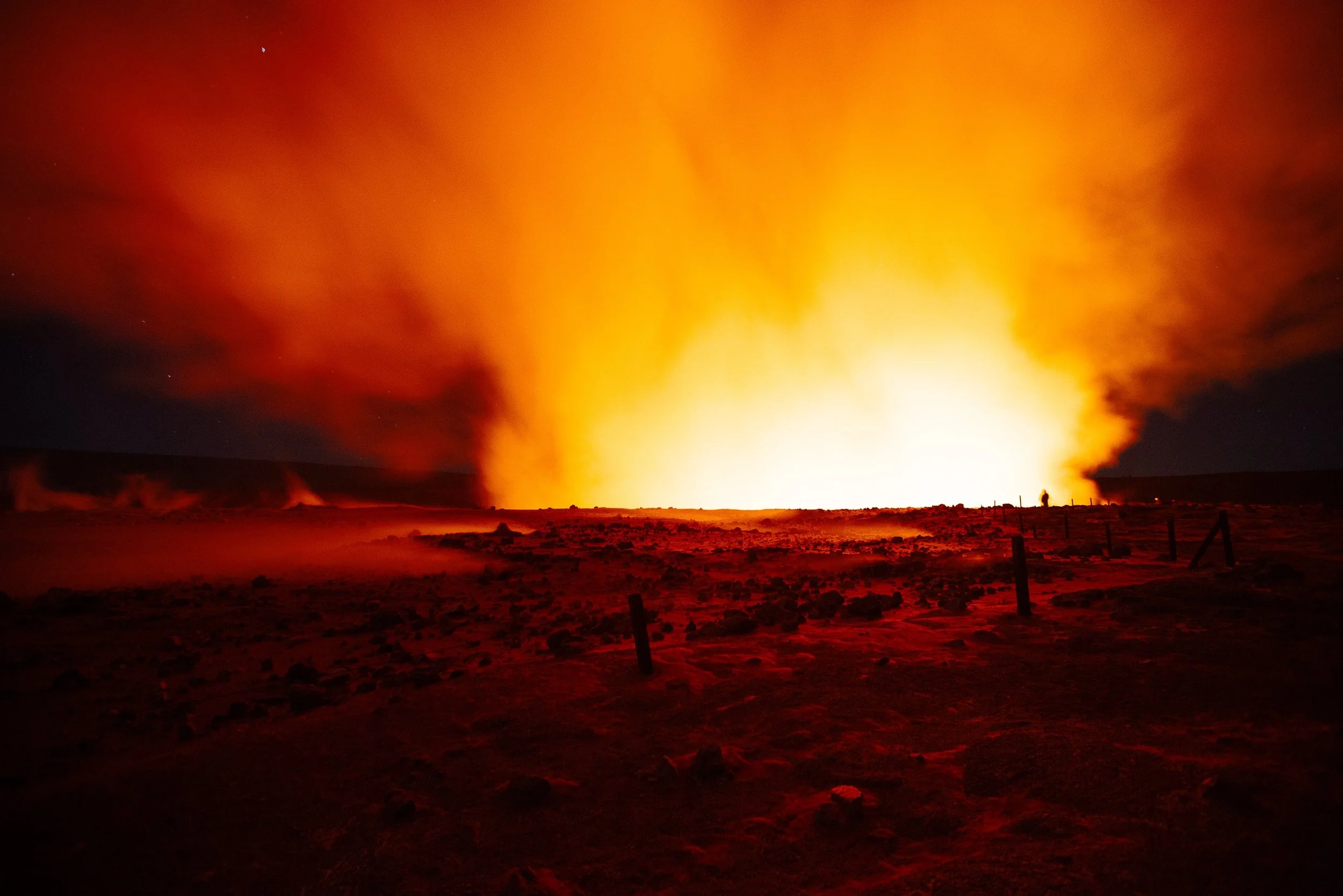 Complete uncropped artwork for Before the Lava, showing an orange volcanic glow expands across a dark landscape under a smoke-filled night sky