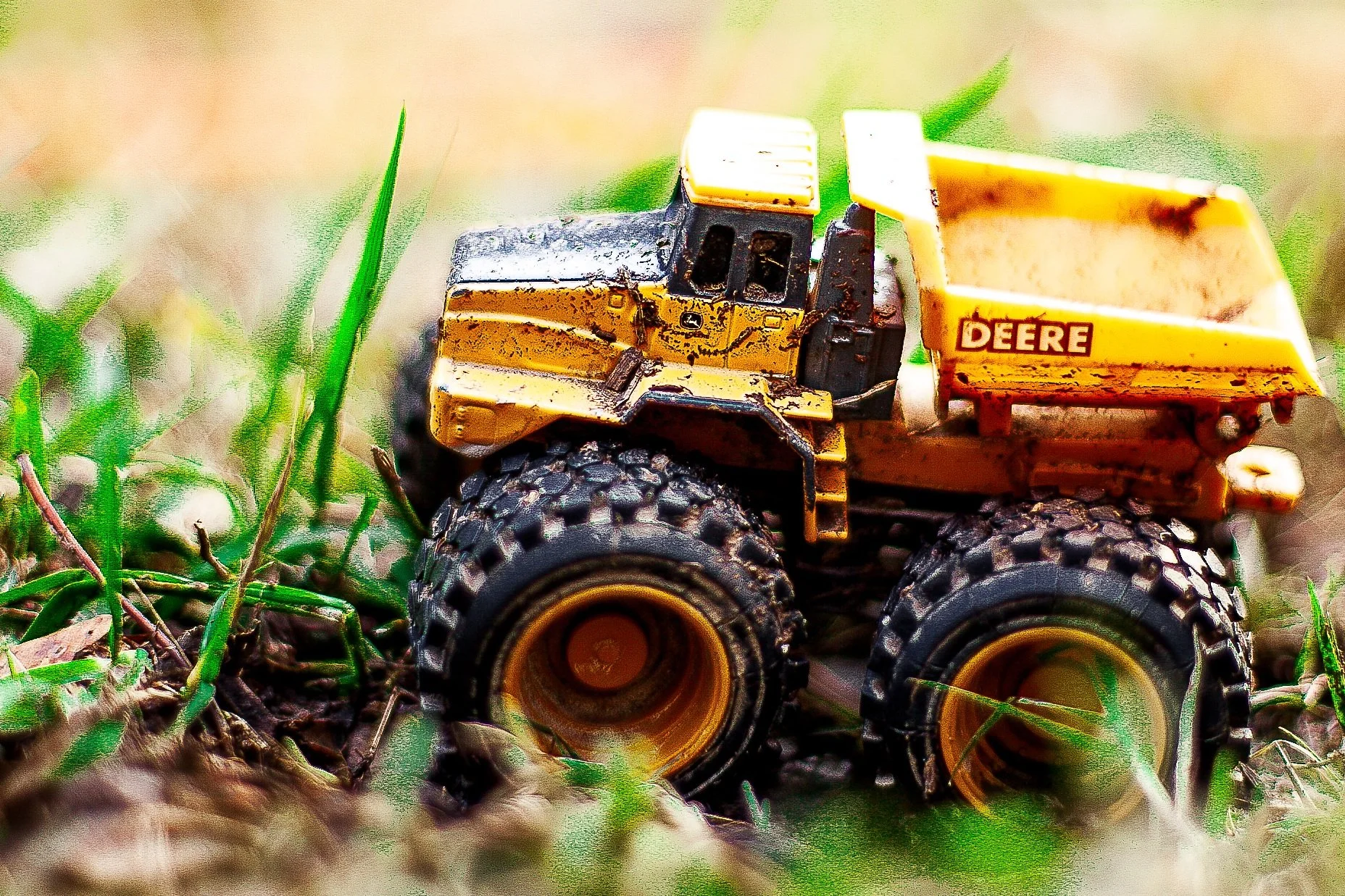 Detail crop from Small Work, emphasizing mud, worn paint, and oversized grass make the change in scale convincing