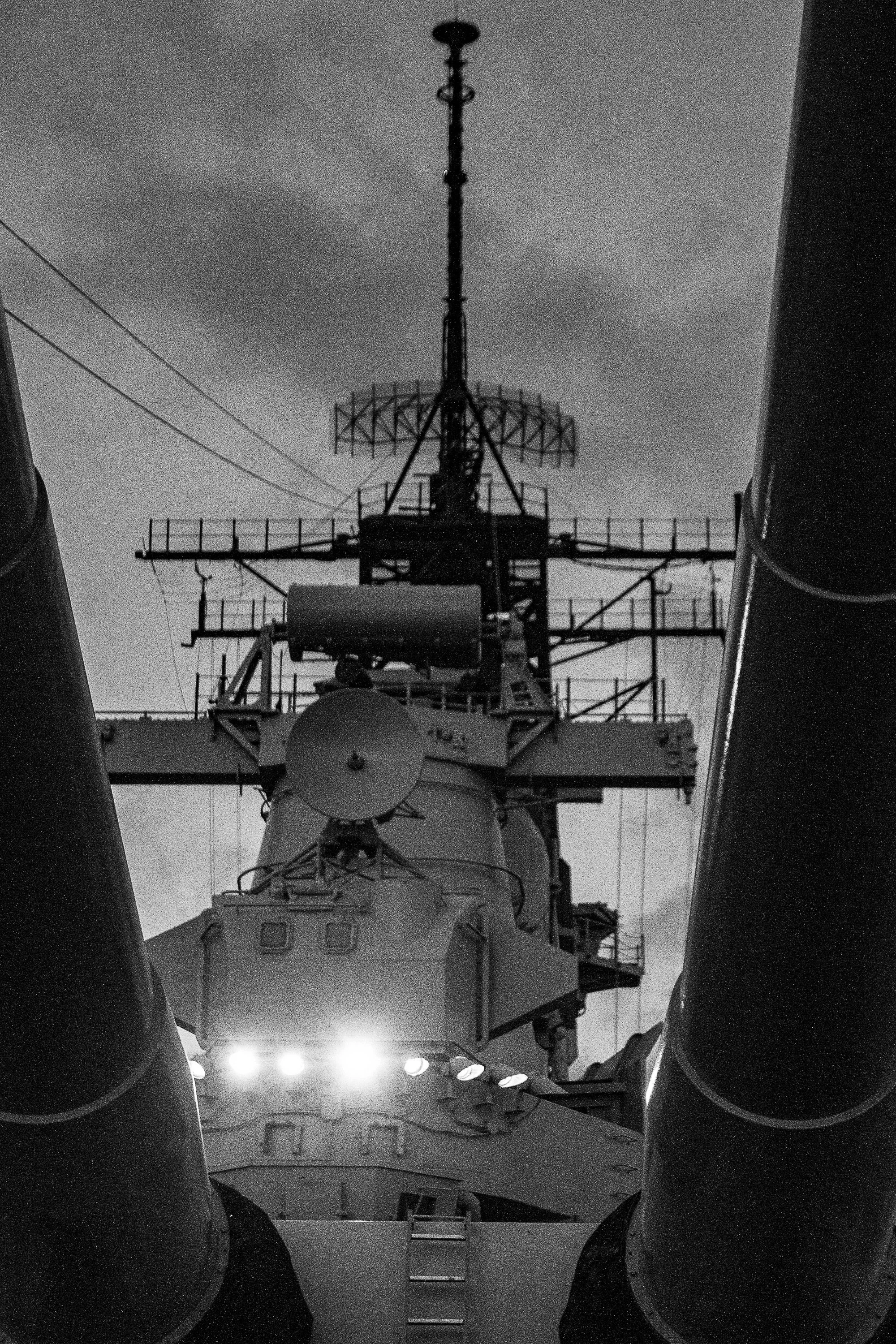 Complete uncropped artwork for Deck Geometry, showing a ship's superstructure rises in black and white between two dark vertical forms