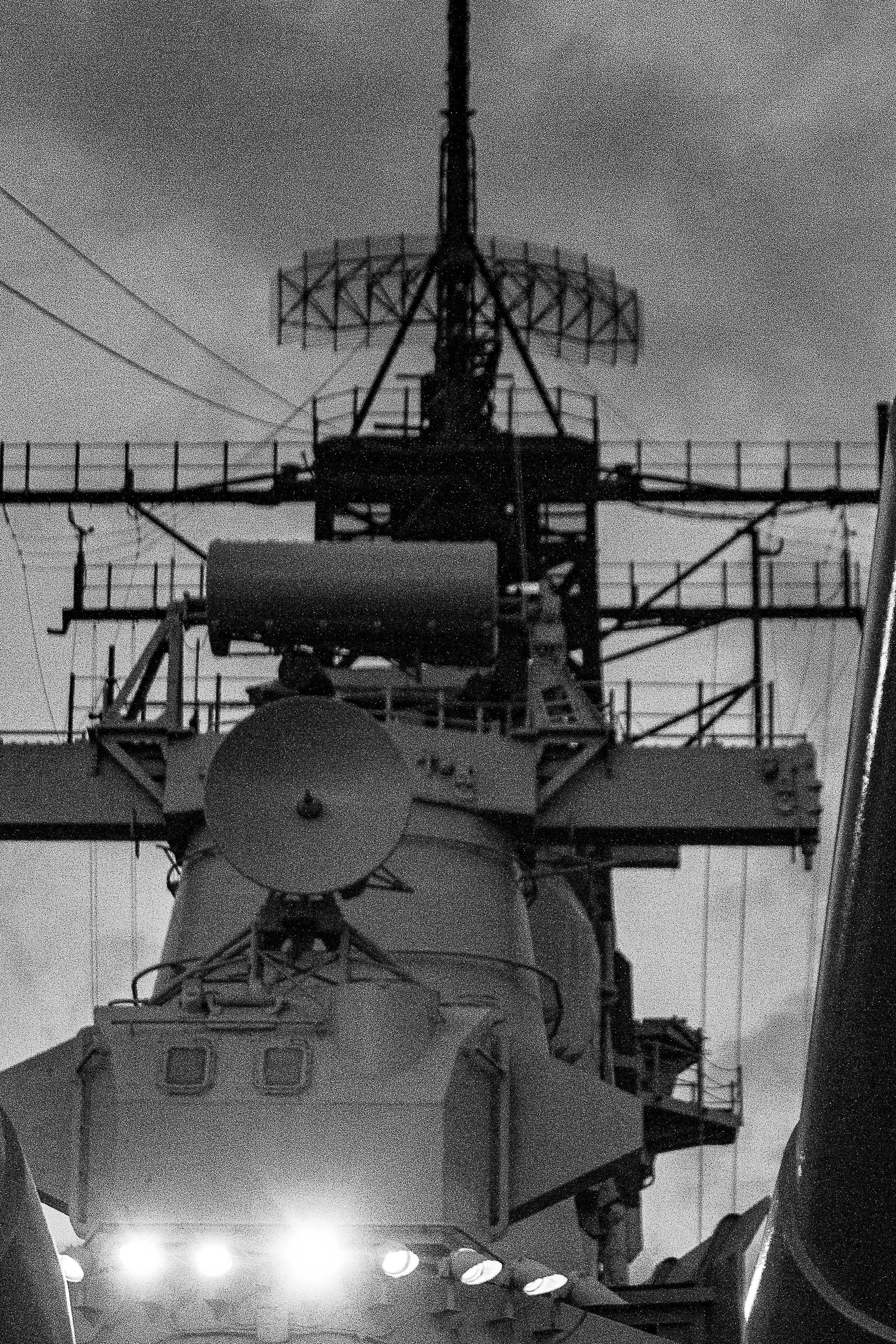 Detail crop from Deck Geometry, emphasizing rails, antennas, and cables reveal the density of the working vessel