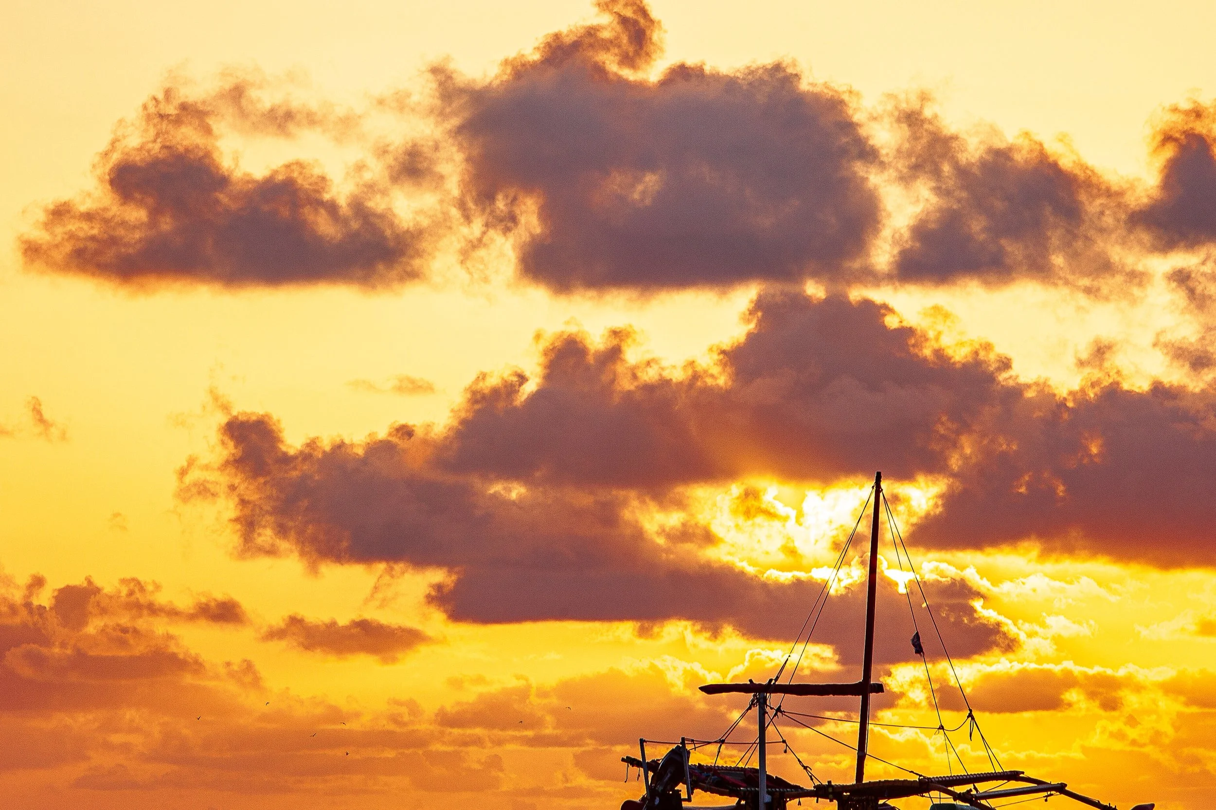 Detail crop from Outrigger Evening, emphasizing outriggers and rigging become delicate marks within the rougher ocean surface