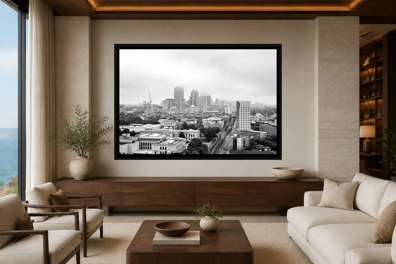 City in Gray displayed in a black frame within a refined oceanfront hotel lounge with pale limestone, walnut, cream linen, and a clear central wall