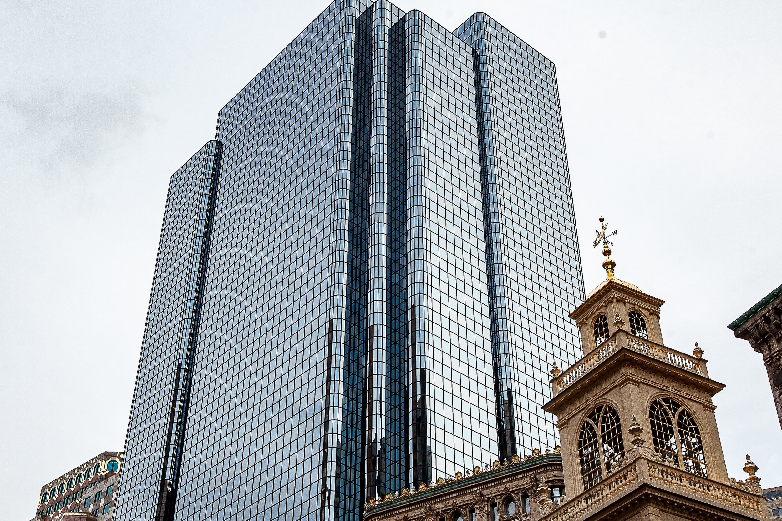 Detail crop from Old and New, emphasizing ornament, glass grids, and changing reflections reveal how each structure treats light