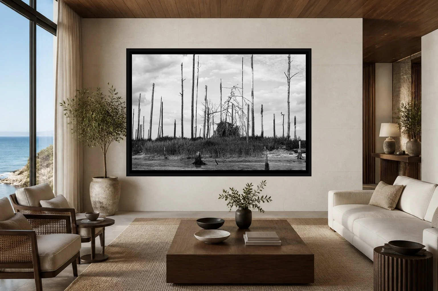 After the Burn displayed in a black frame within a refined oceanfront hotel lounge with pale limestone, walnut, cream linen, and a clear central wall