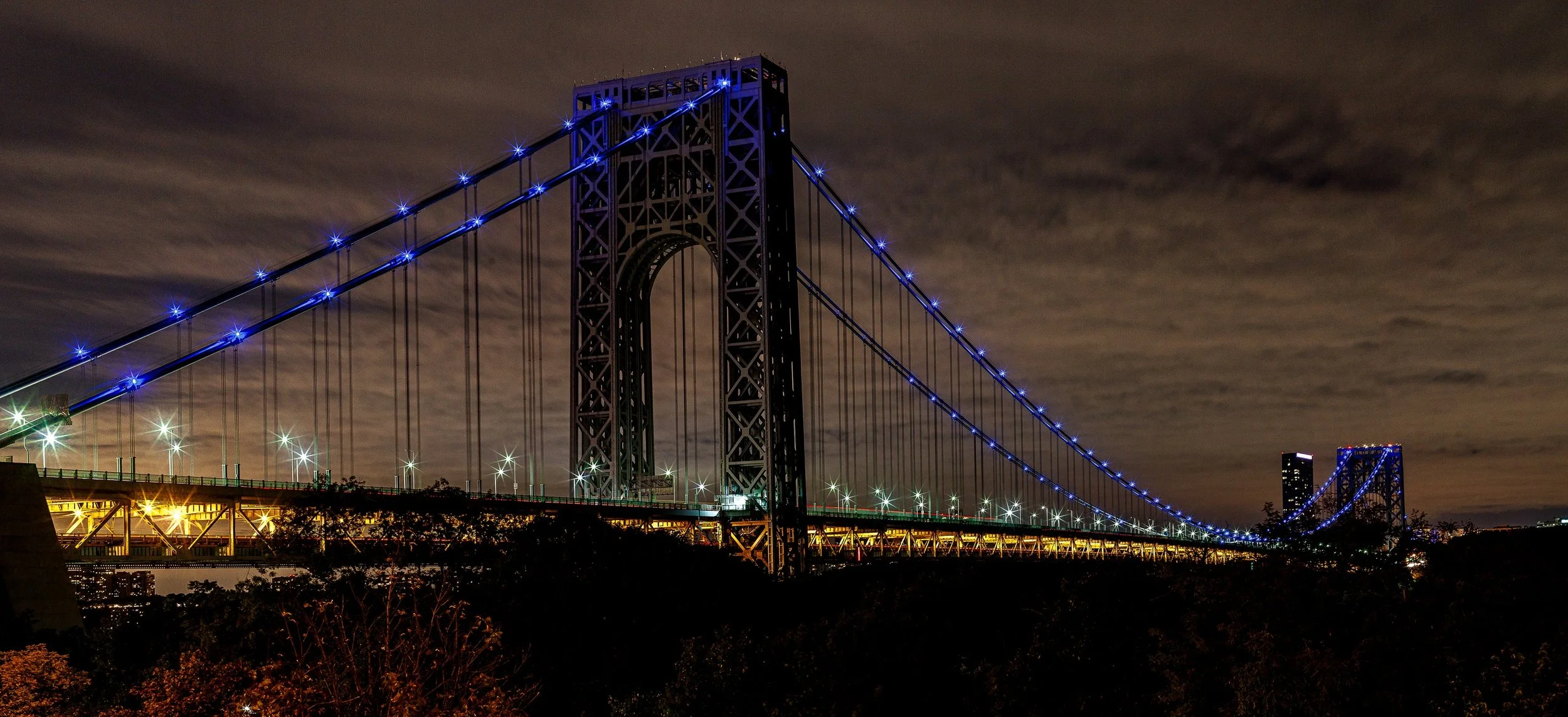 Detail crop from Blue Suspension, emphasizing cables and roadway lines create separate rhythms across the wide panorama
