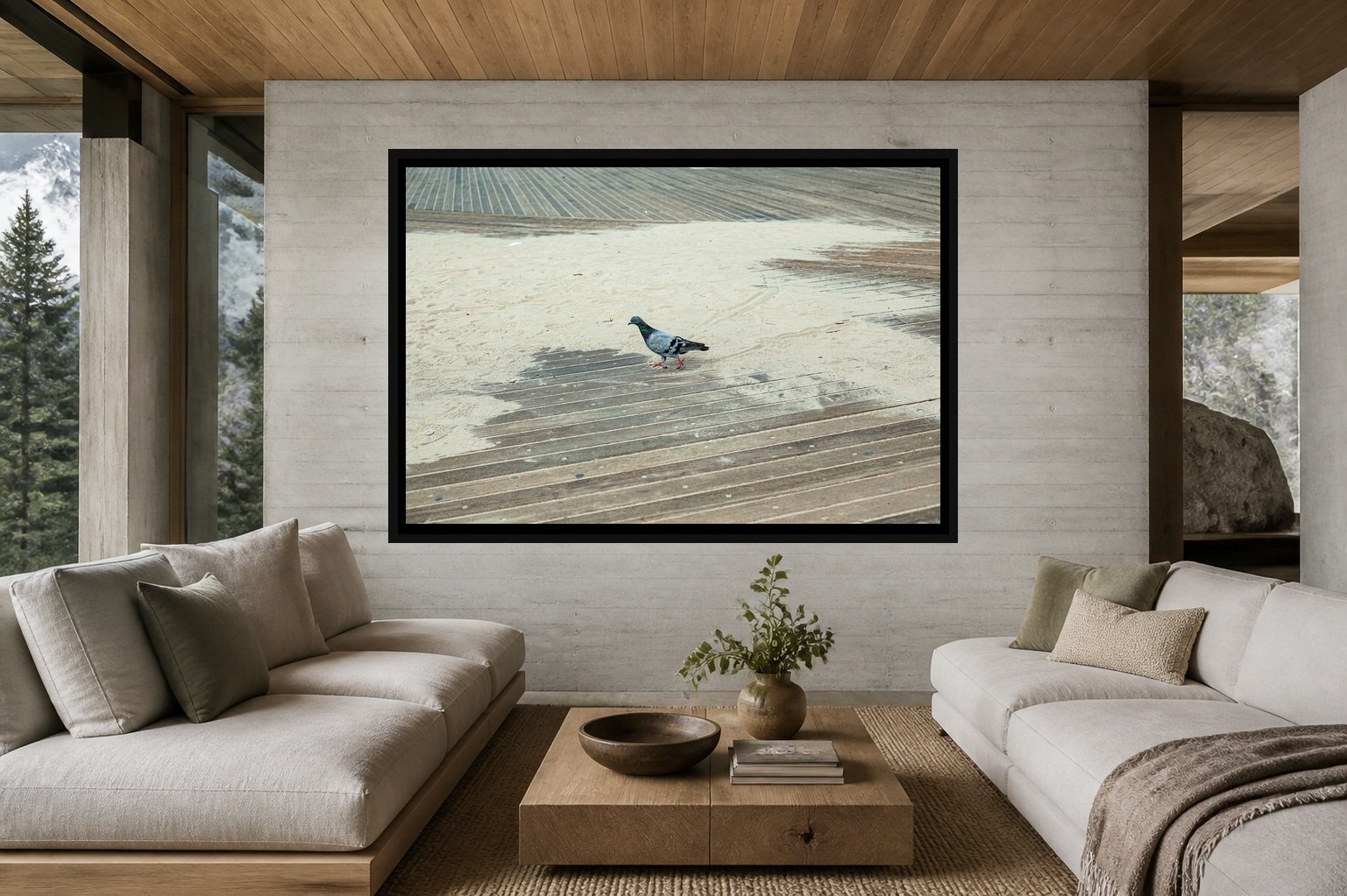 A Pigeon Walks Alone displayed in a black frame within a contemporary mountain residence with board-formed concrete, oak, soft neutral upholstery, and a clear central wall