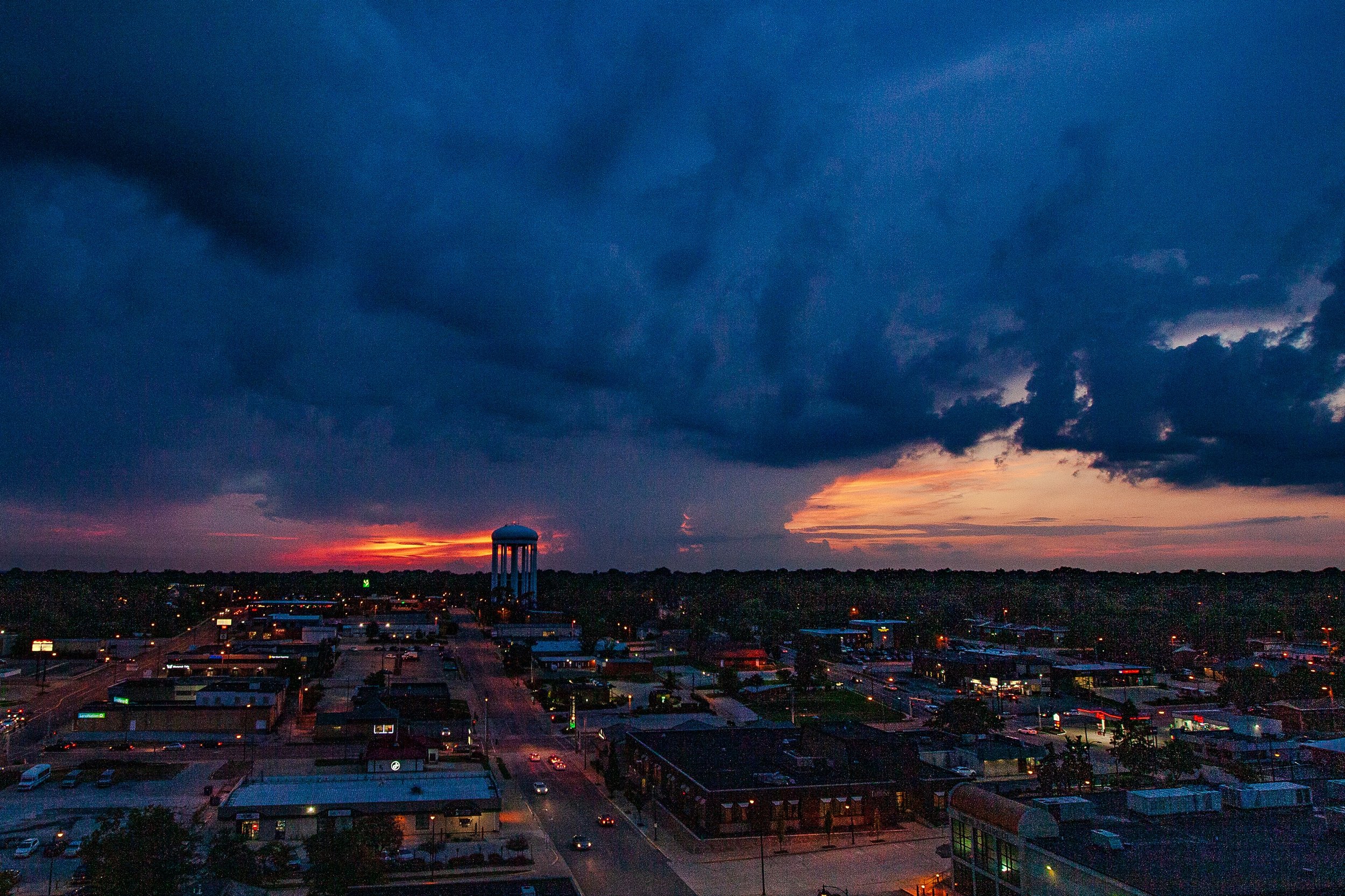 Detail crop from Storm Over Town, emphasizing roads and scattered lights show how small the town is beneath the cloud structure