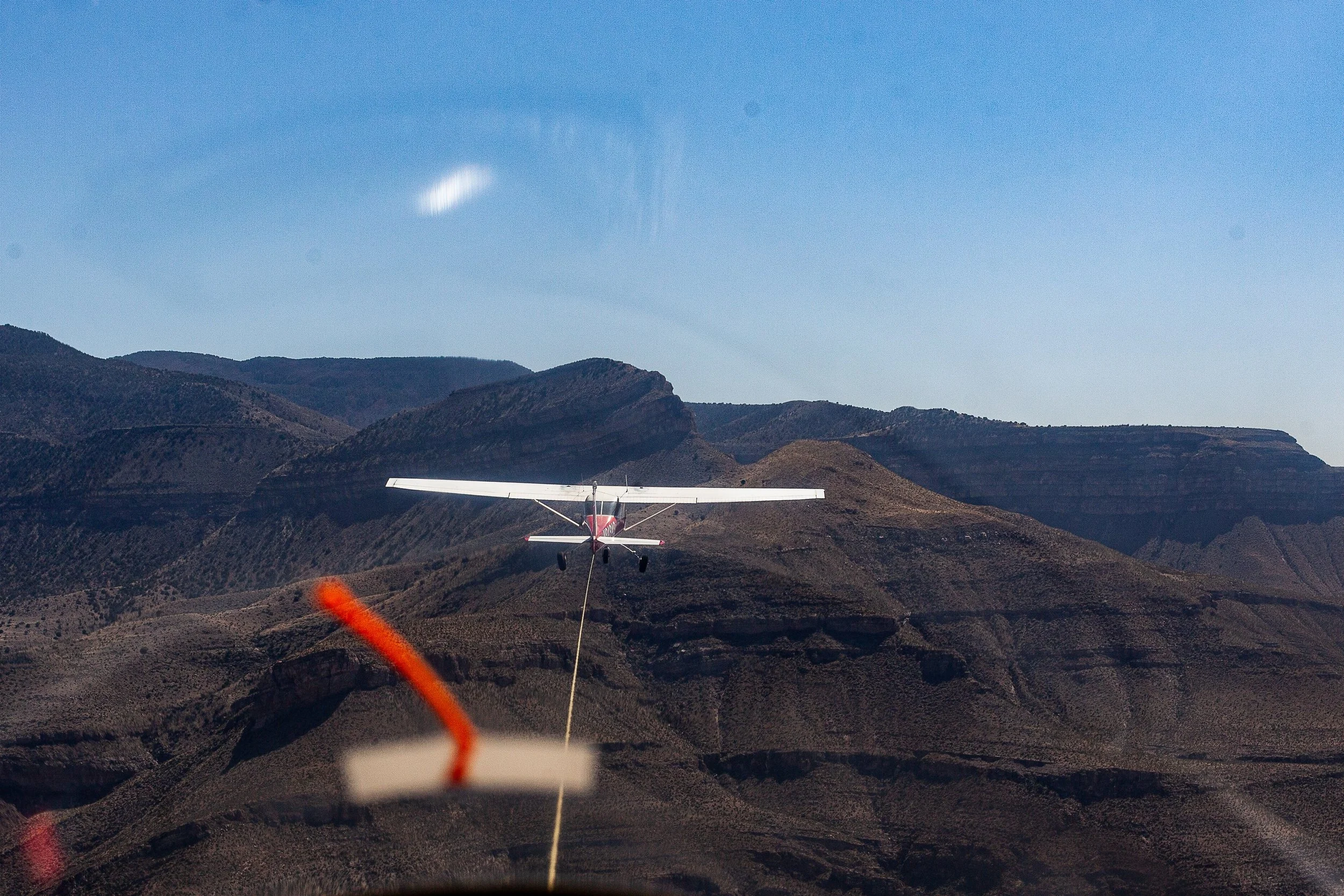 Detail crop from Final Approach, emphasizing guidance marks, terrain, and windshield reflections deepen the layered perspective