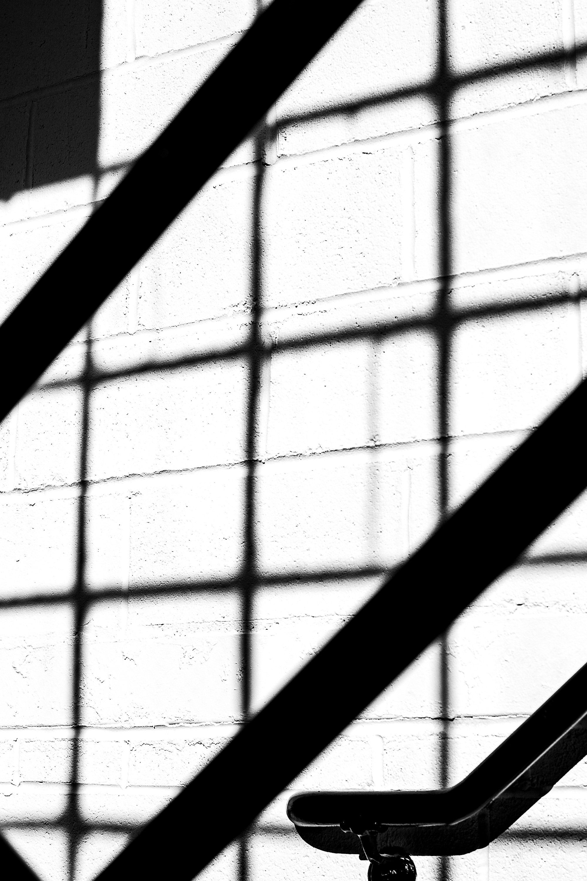 Detail crop from Shadow Rail, emphasizing small bolts and pane divisions return the composition to its physical setting
