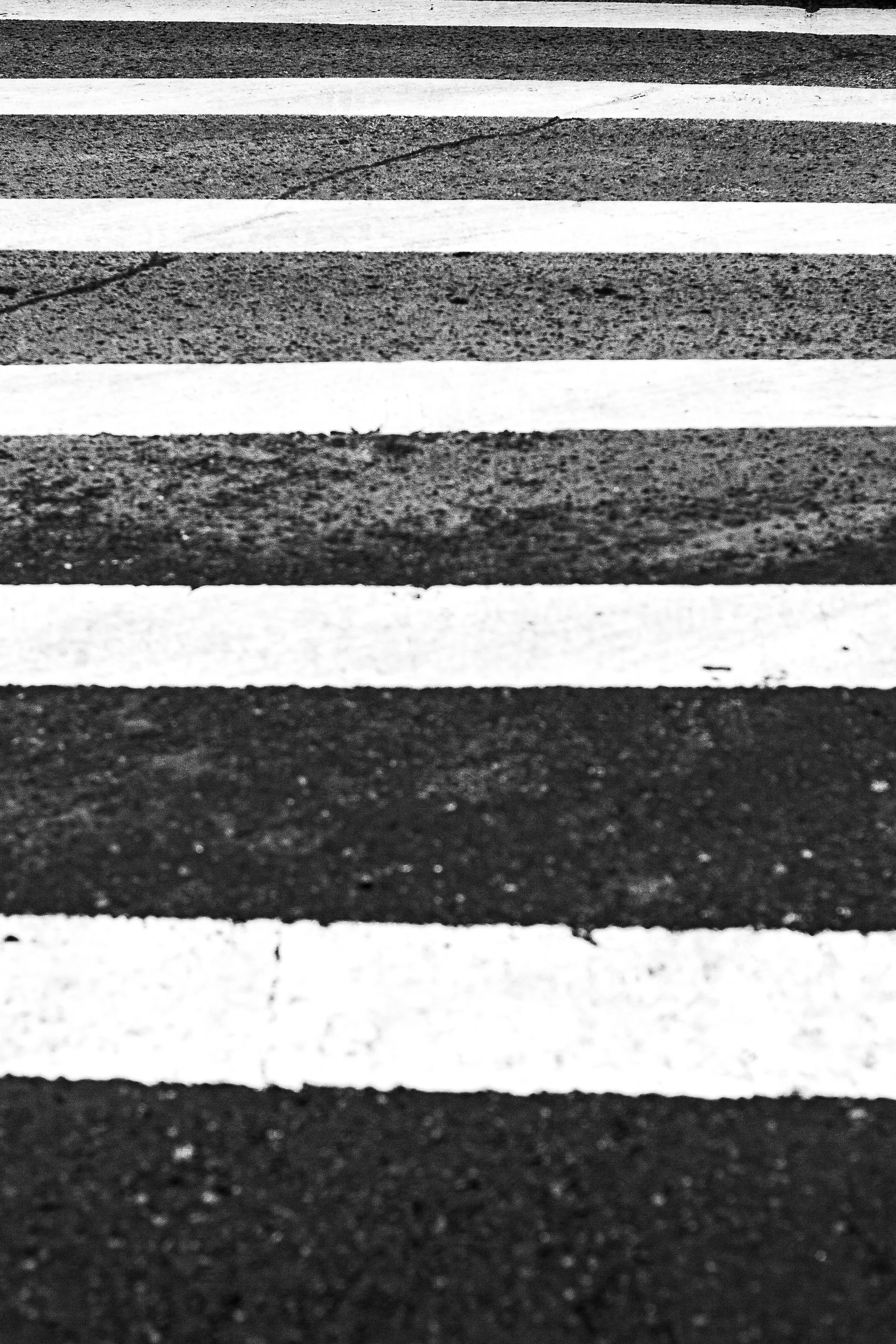 Detail crop from Crossing Lines, emphasizing rubber texture and worn paint keep the geometry grounded in everyday use