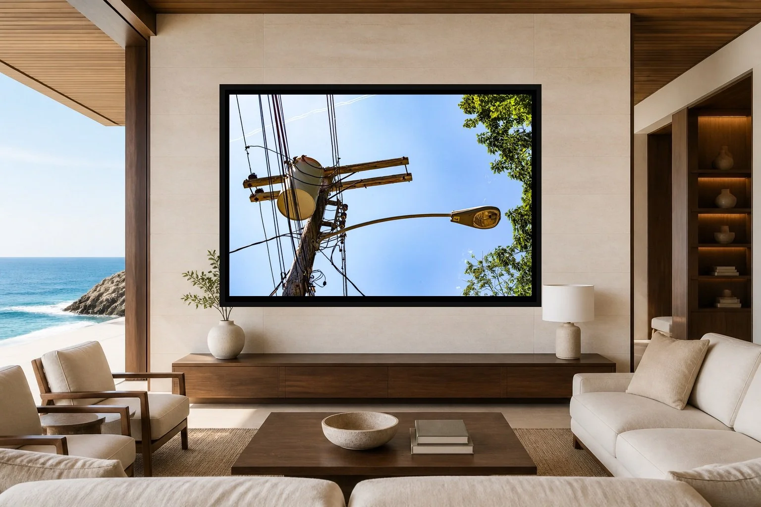 Utility Sky displayed in a black frame within a refined oceanfront hotel lounge with pale limestone, walnut, cream linen, and a clear central wall