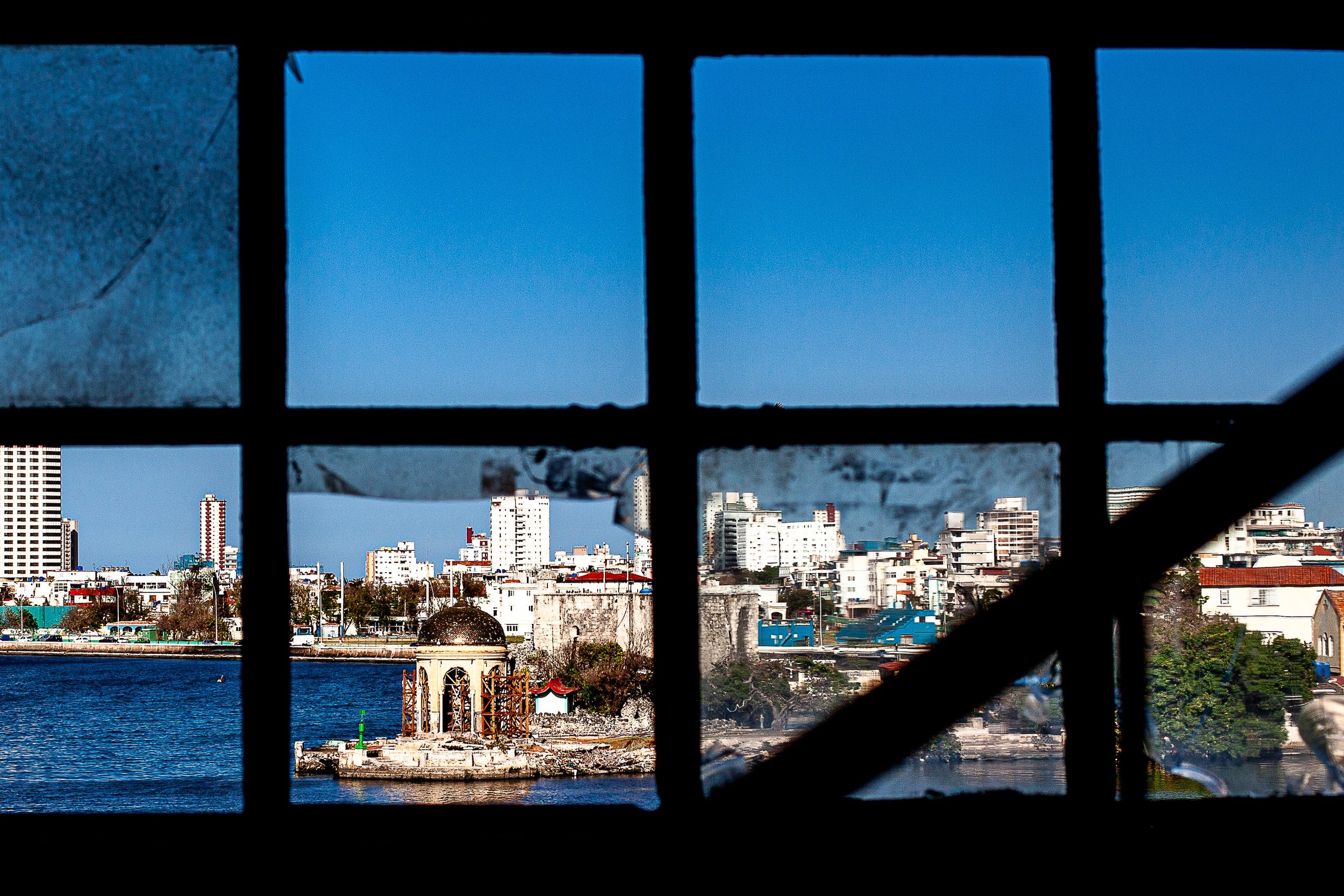 Detail crop from City in Nine Frames, emphasizing boats, buildings, and reflections shift character from pane to pane