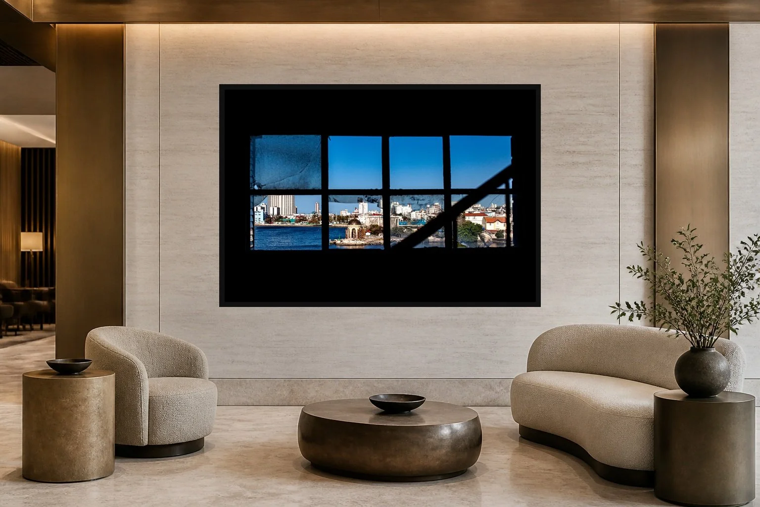 City in Nine Frames displayed in a black frame within a five-star hotel corridor lounge with travertine, bronze, sculptural seating, and a clear central wall