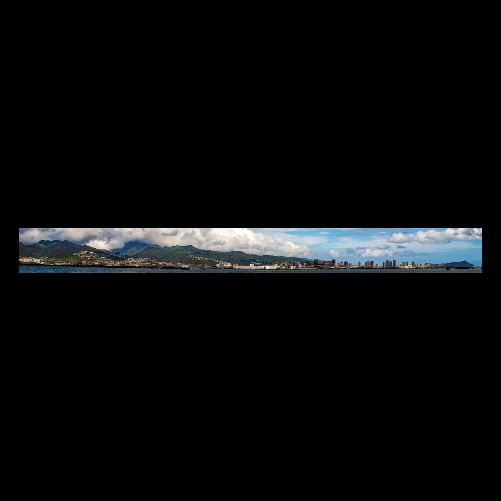 Full-frame black presentation thumbnail of Mountain City, showing a long coastal city lies beneath green mountains and heavy white clouds