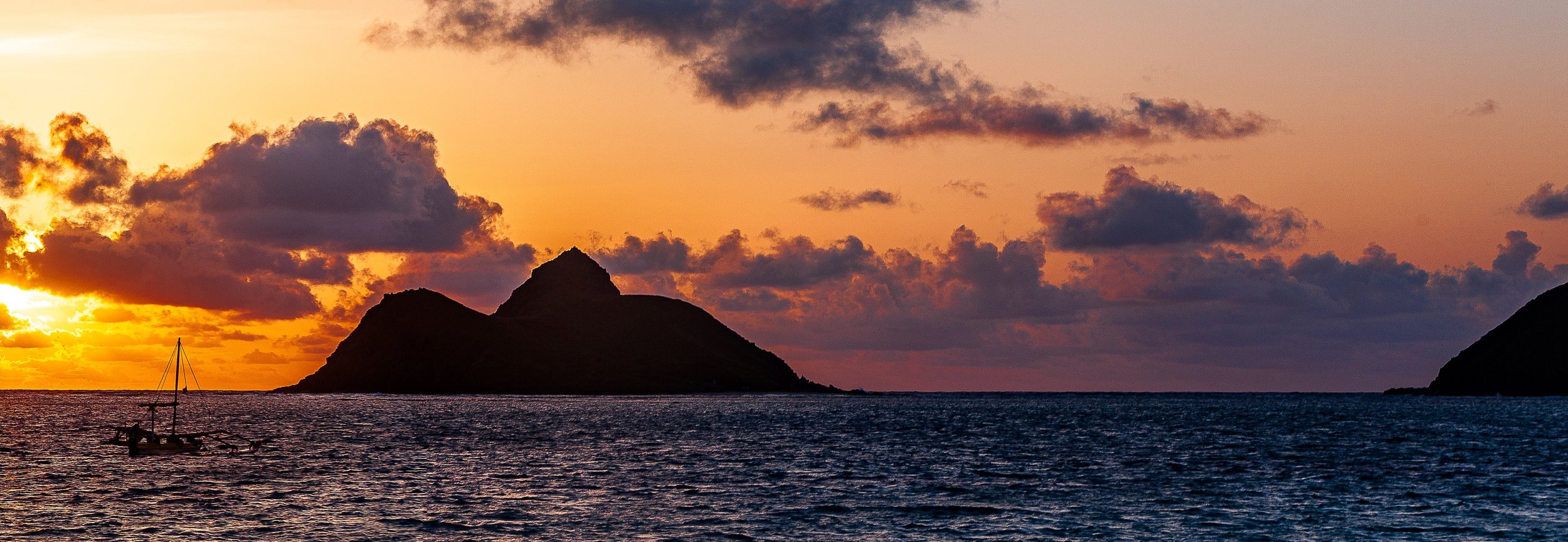 Detail crop from Islands at Sunset, emphasizing small cloud bands and gentle surface texture make the horizon more layered