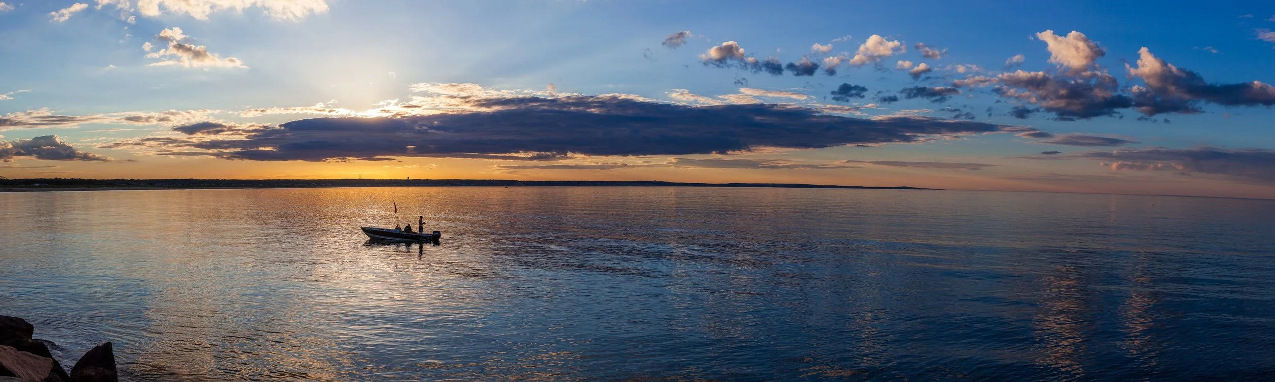 Complete uncropped artwork for Boat on Still Water, showing a small boat rests on reflective water beneath a long layered evening sky