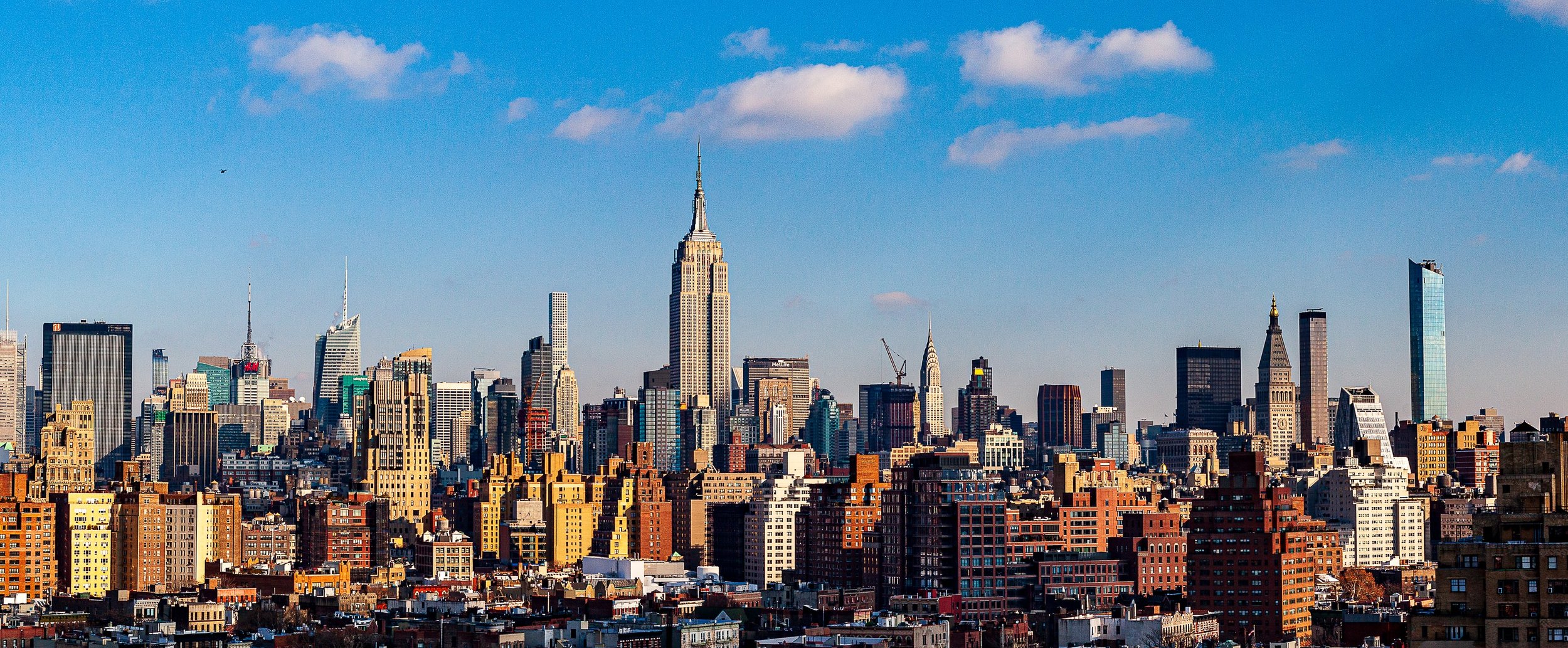 Detail crop from Empire Distance, emphasizing water towers, rooftops, and individual towers emerge from the larger mass