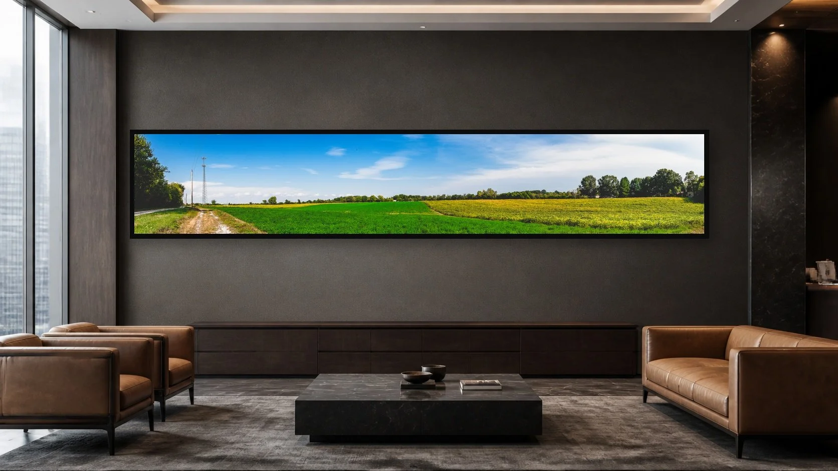 Road Through Green displayed in a black frame within a high-rise executive waiting room with charcoal stone, smoked oak, restrained leather seating, and a clear central wall