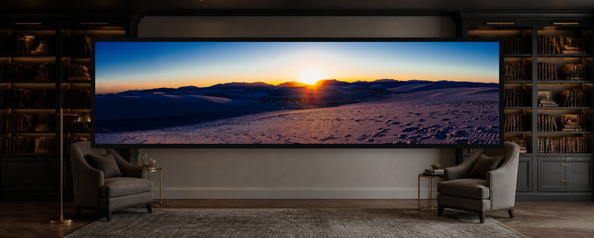 White Sand Dunes displayed in a black frame within a quiet private library with dark shelving, warm brass, tailored wool seating, and a clear central wall