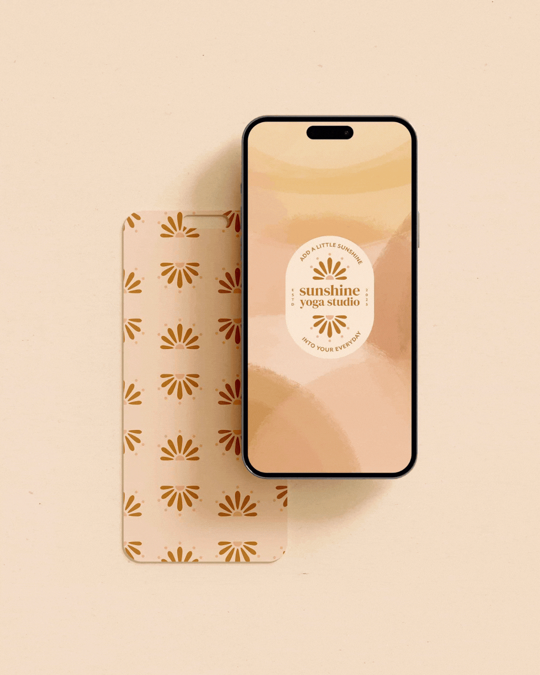 An iPhone displaying the Sunshine Yoga Studio app with a beige and peach abstract background. Next to the phone is a matching beige card with a repeating brown floral pattern.