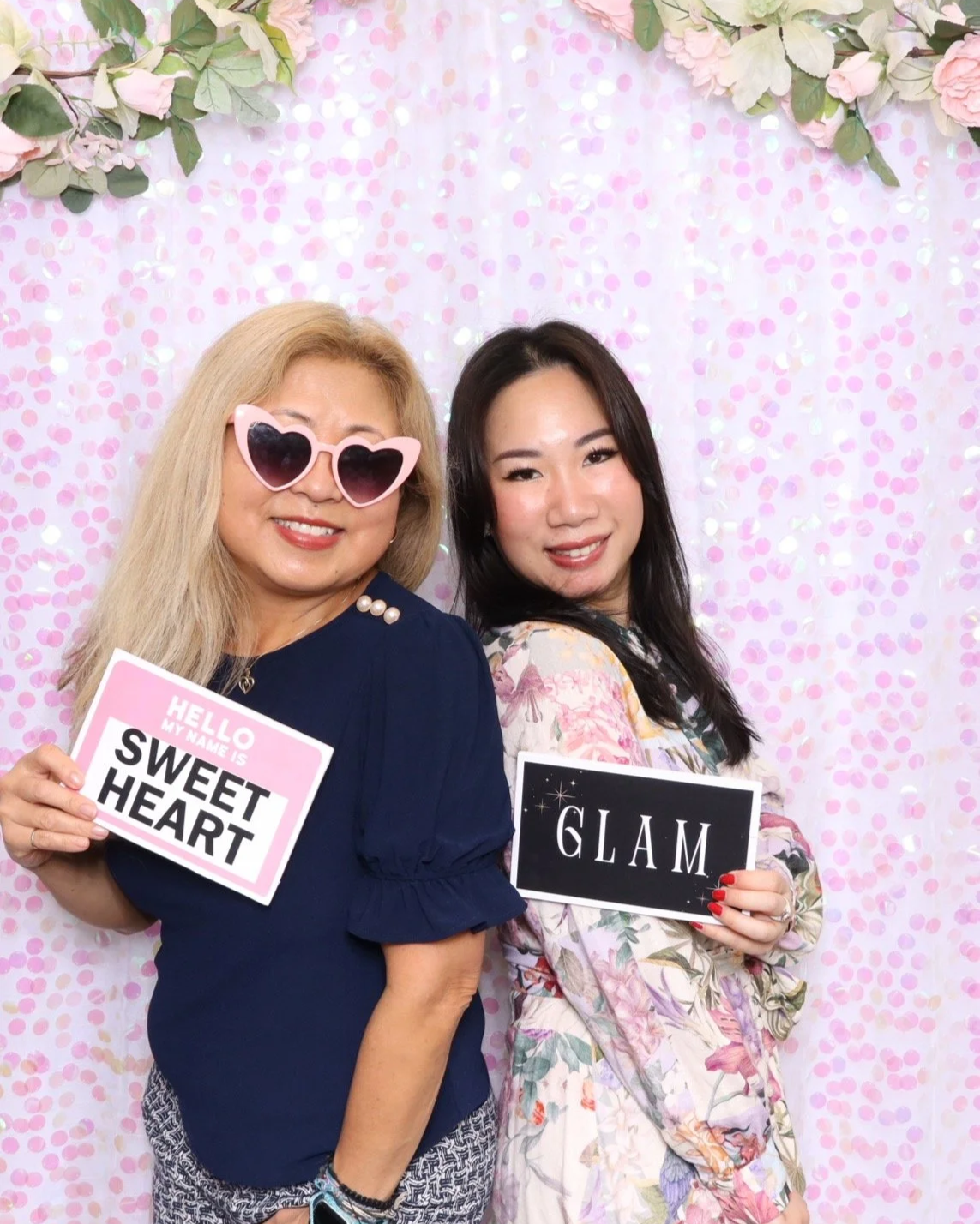 Women Posing with signs " Sweet Heart " and " Glam" 