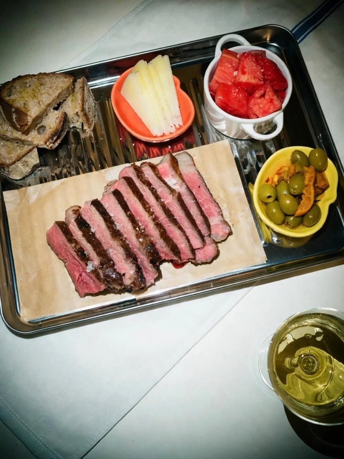 I don&rsquo;t eat red meat often, but when I do, I&rsquo;m thinking of Spain. 

Standing up at a little table on the streets in San Sebasti&aacute;n, sharing tomato salad with good olive oil, mopping up the drippings with crusty bread, and drinking t