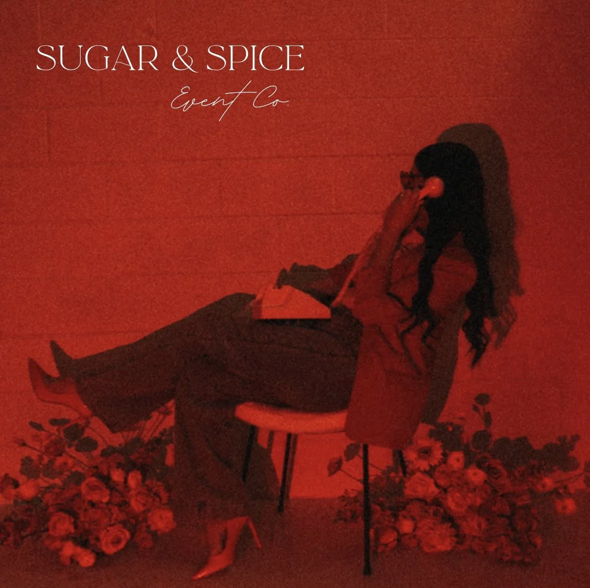 Red background with a woman sitting on a chair, wearing red shoes, surrounded by flowers, holding a phone to her ear, and the text "SUGAR & SPICE Event Co." in the top left corner.