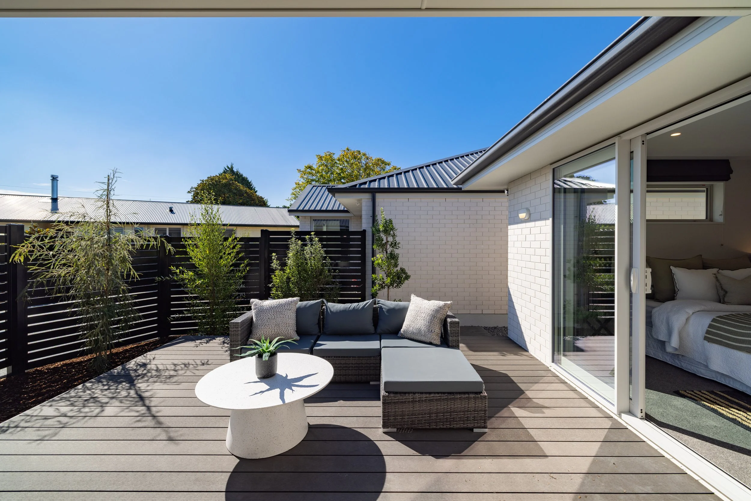 Composite decking is a man-made material designed to combine the natural look of wood with the durability of modern plastics. It is typically made from reclaimed wood fibers and plastic composites. New build in Christchurch by Dennehy Construction.