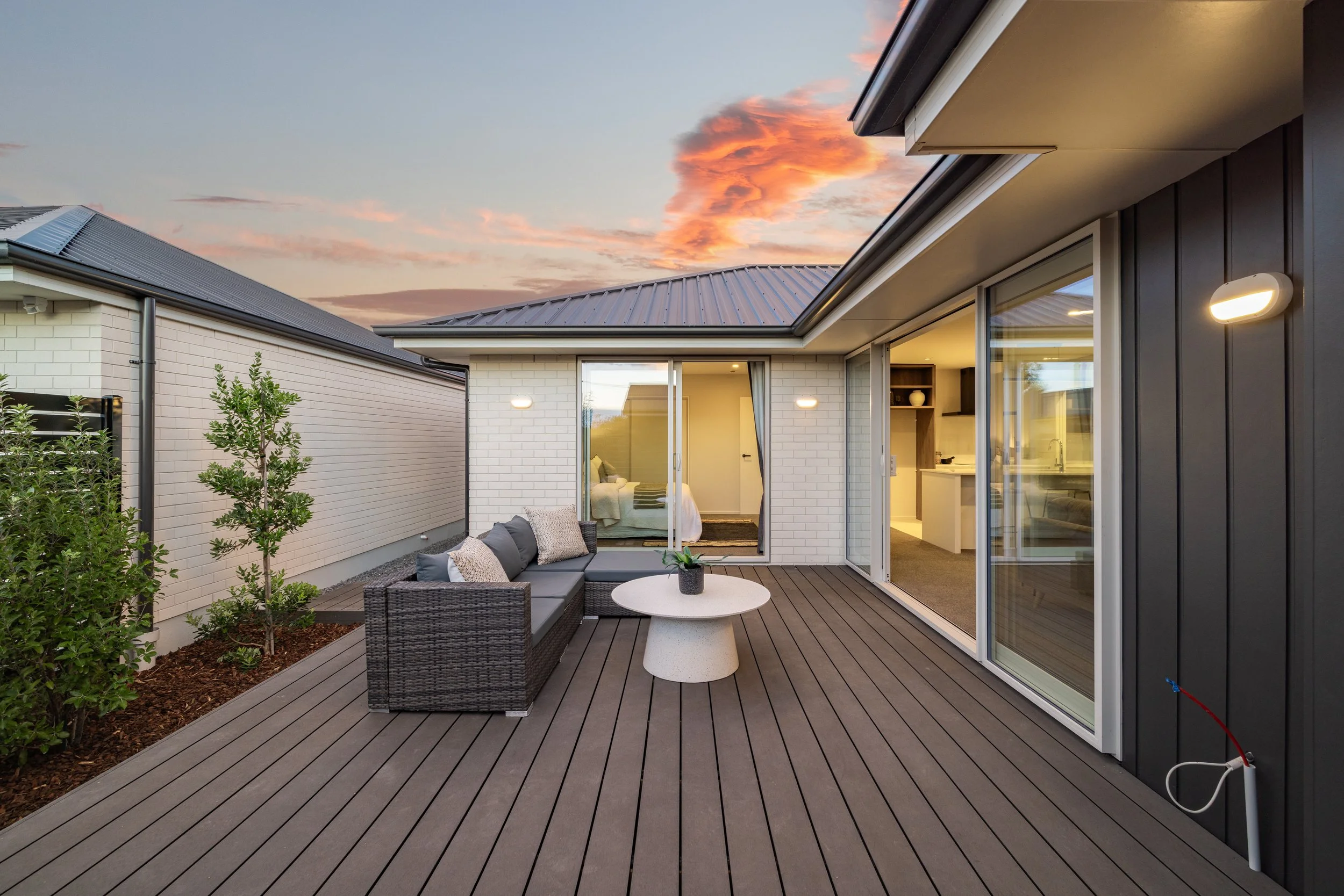 Three standalone units, composite decking, simple landscaping, modern cladding. New Build, by Dennehy Construction, Christchurch.