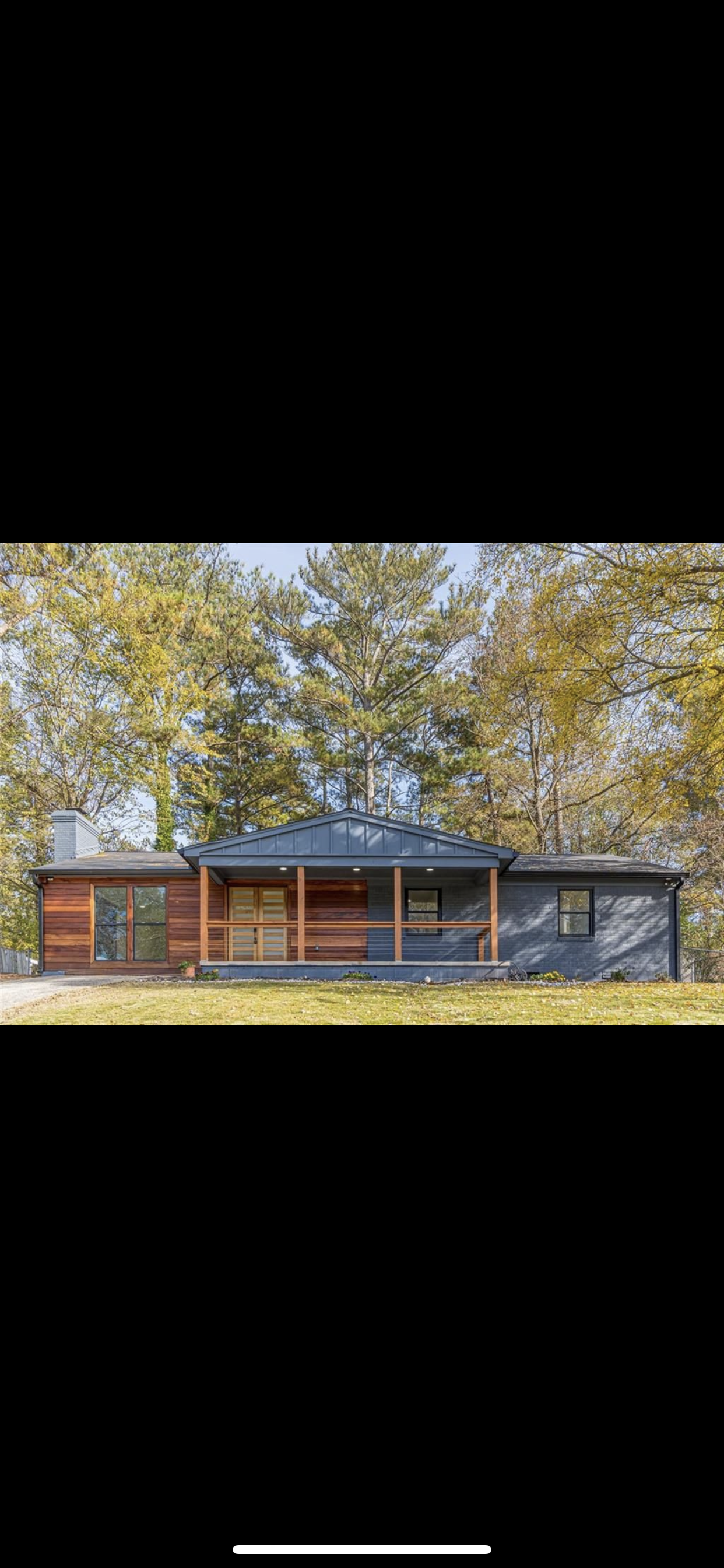 Snow-capped mountains in the background with grassy hills in the foreground