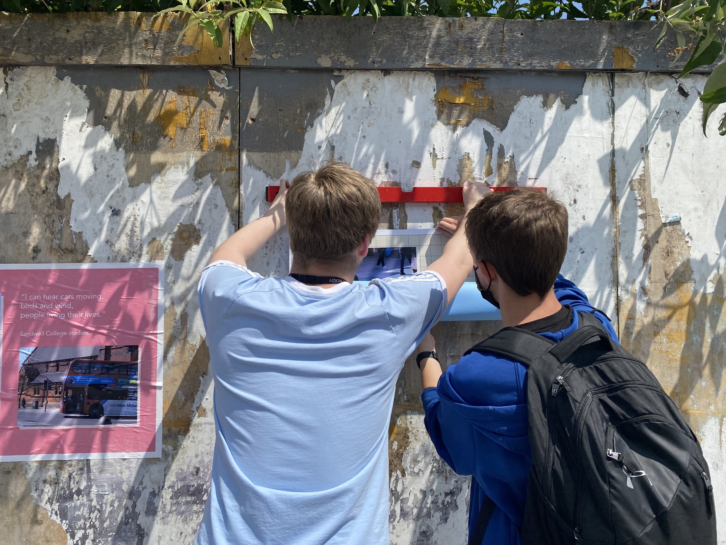 Images of the install of the exhibitions; all the students were involved in pasting up their work.