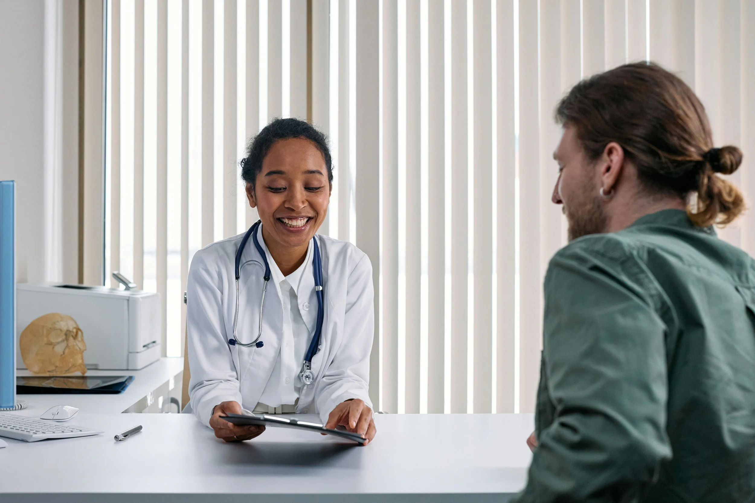 A Doctor Talking the Patient (cottonbro studio)